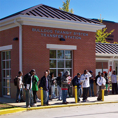 Students wait for a bus at the BTS Transfer Station