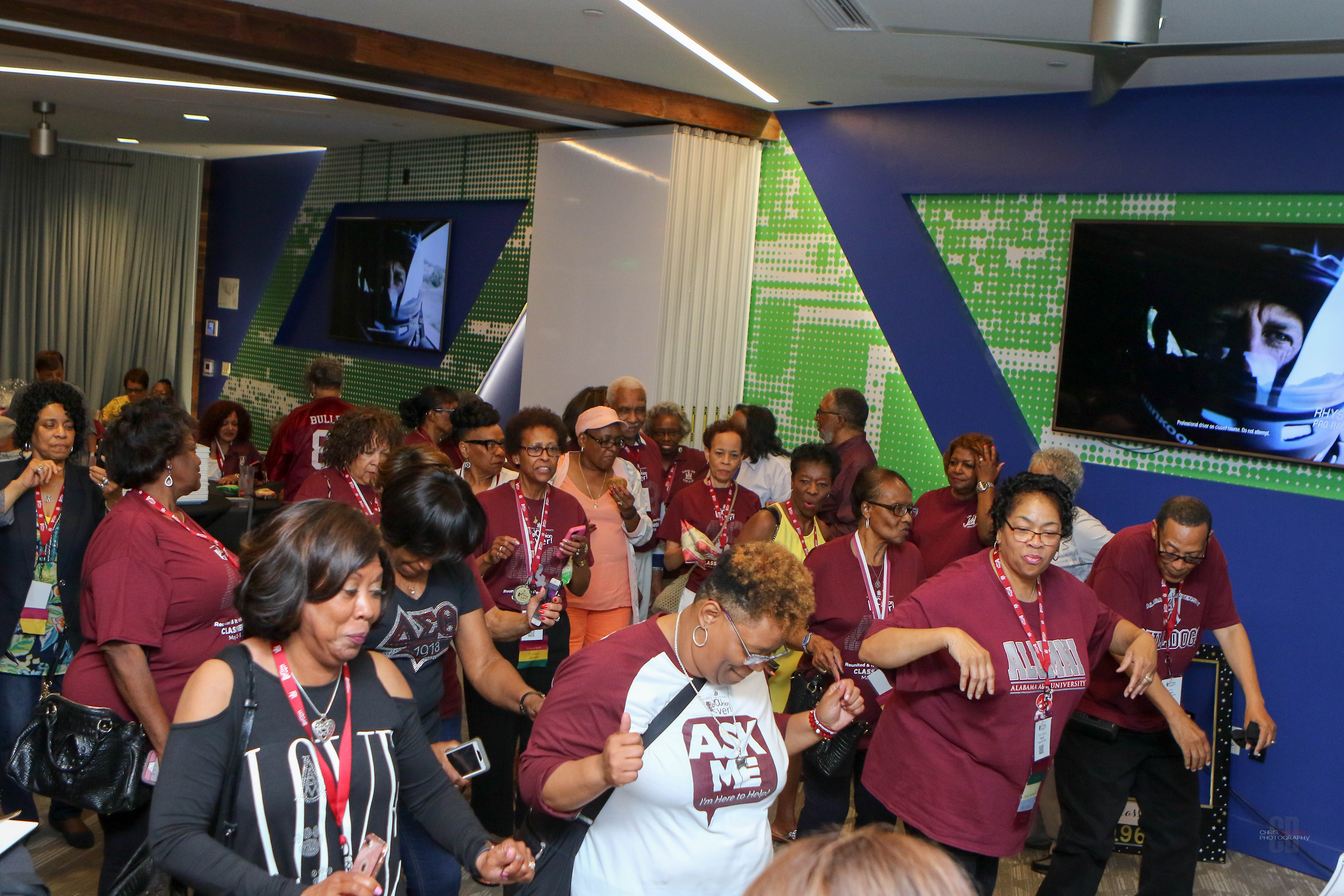 A photo of alumni enjoying themselves and dancing at the reunion event