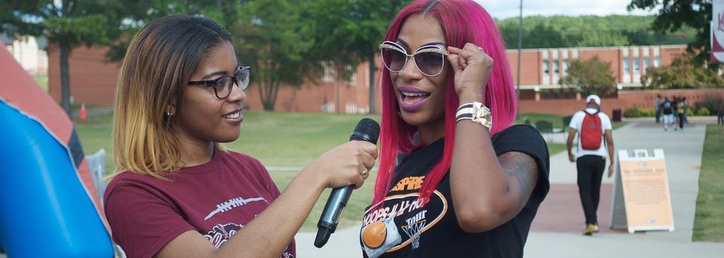 An AAMU student interviews another student at a student event