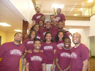 Group photo of Wellness Center employees wearing SHWC T-shirts