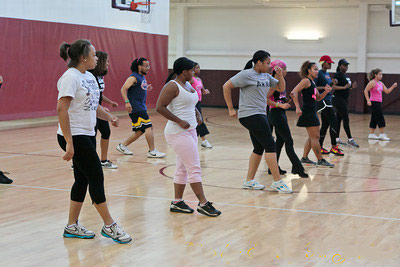 A fitness class exercises in the gymnasium