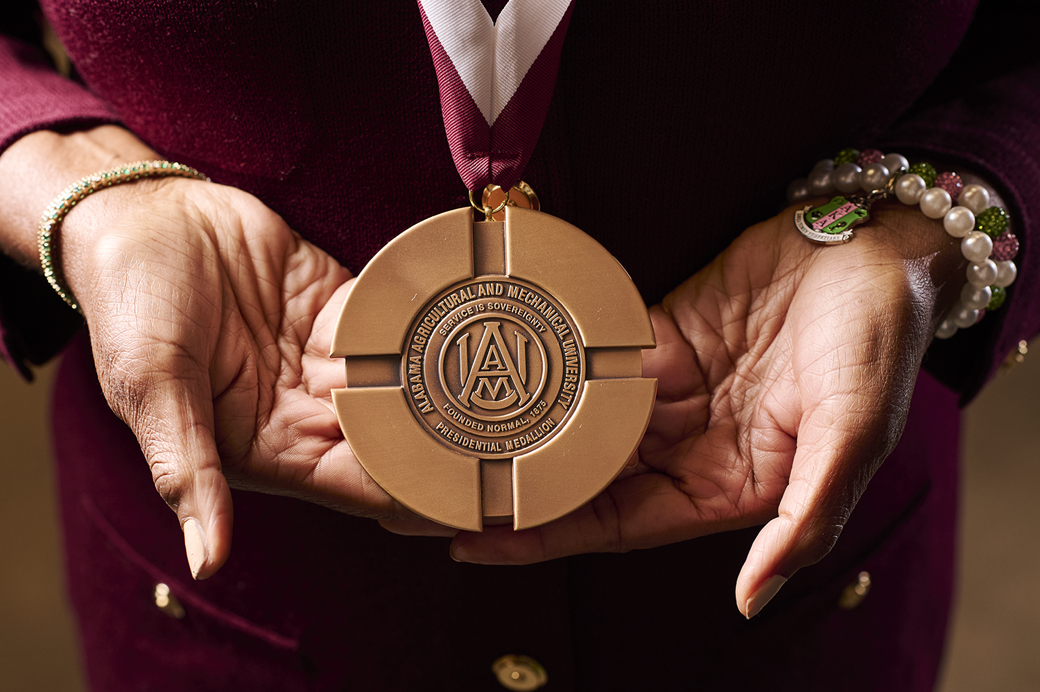 Medallion recognizing 150th Anniversary Torchbearers