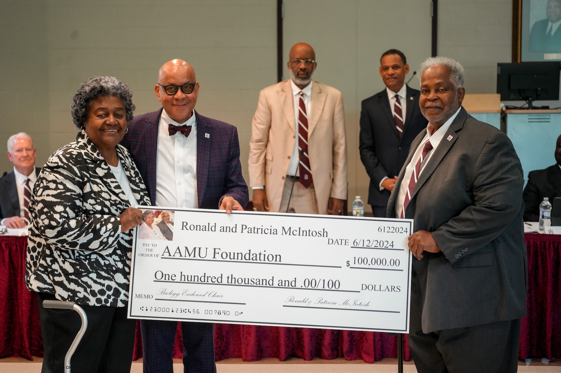 Ronald & Patricia McCalep-McIntosh Sr. Present a $100,00 Check for the Endowed Chair in Biology at the AAMU June 14, 2024 Board Meeting.