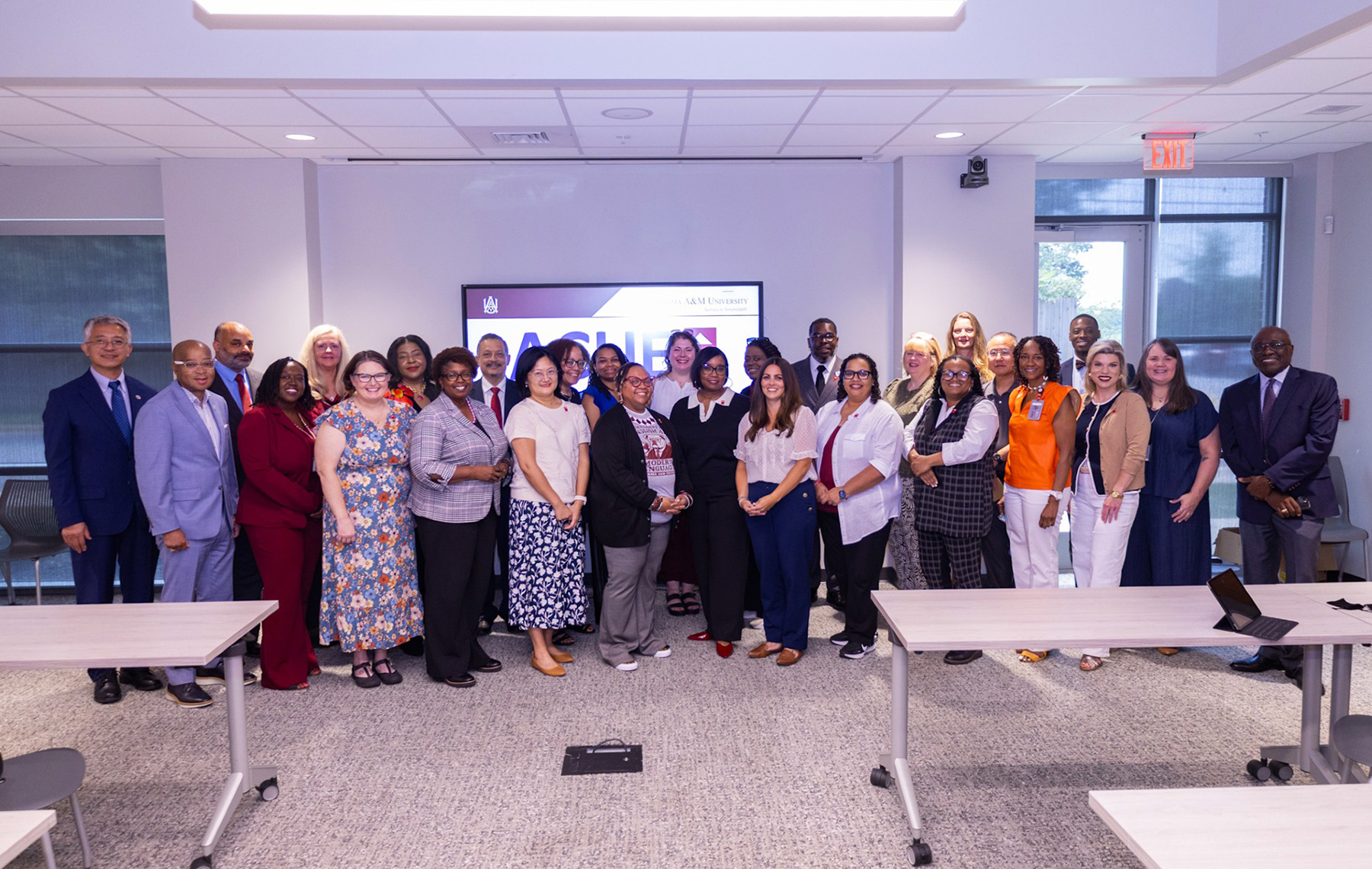AAMU faculty members recognized during the ACUE Pinning and Certificate Ceremony gather for a group photo following the celebration.