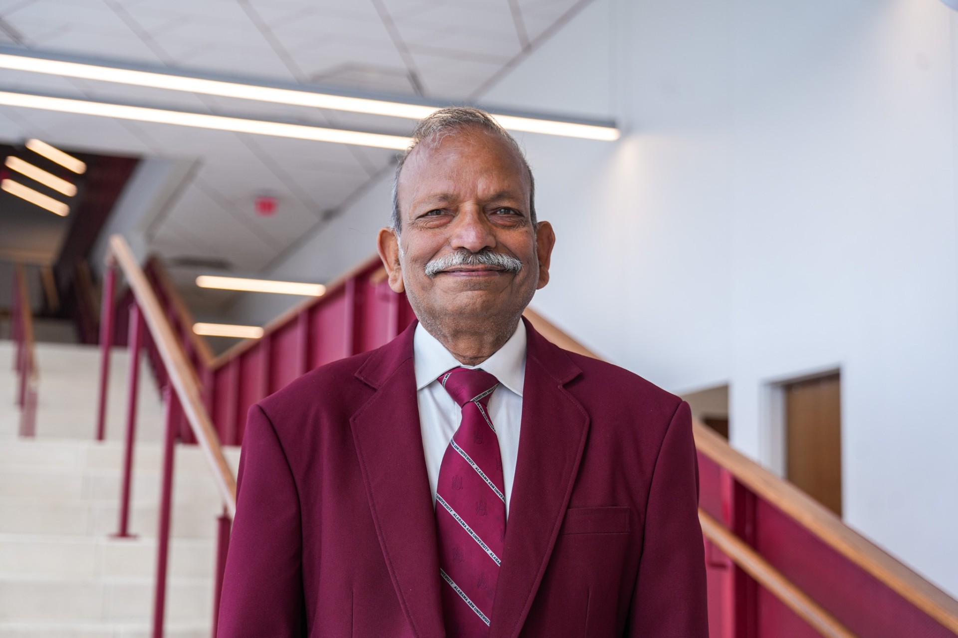 Dr. Mohan Aggarwal smiling in the AAMU Event Center