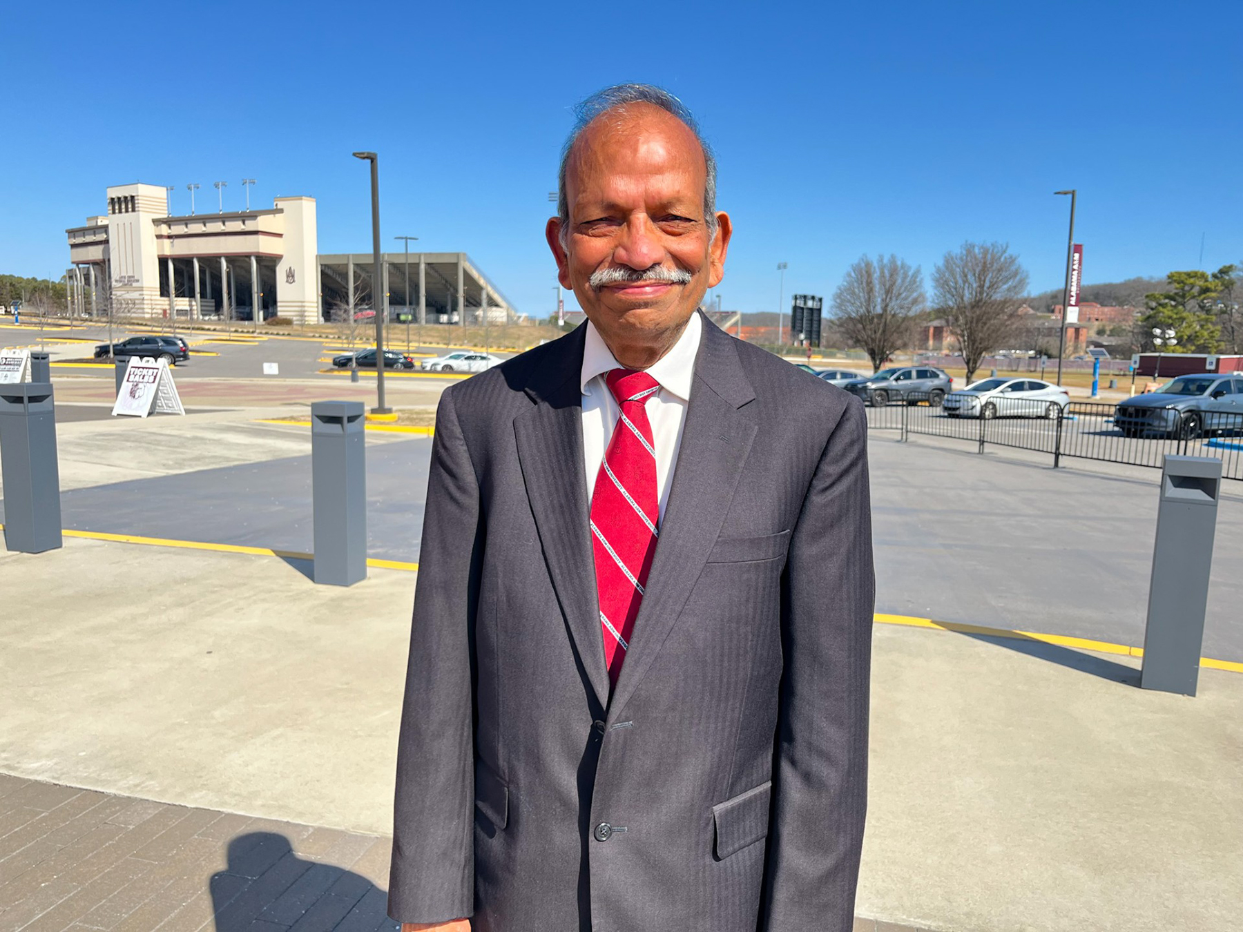 Dr. Mohan Aggarwal smiles outside the AAMU Event Center.