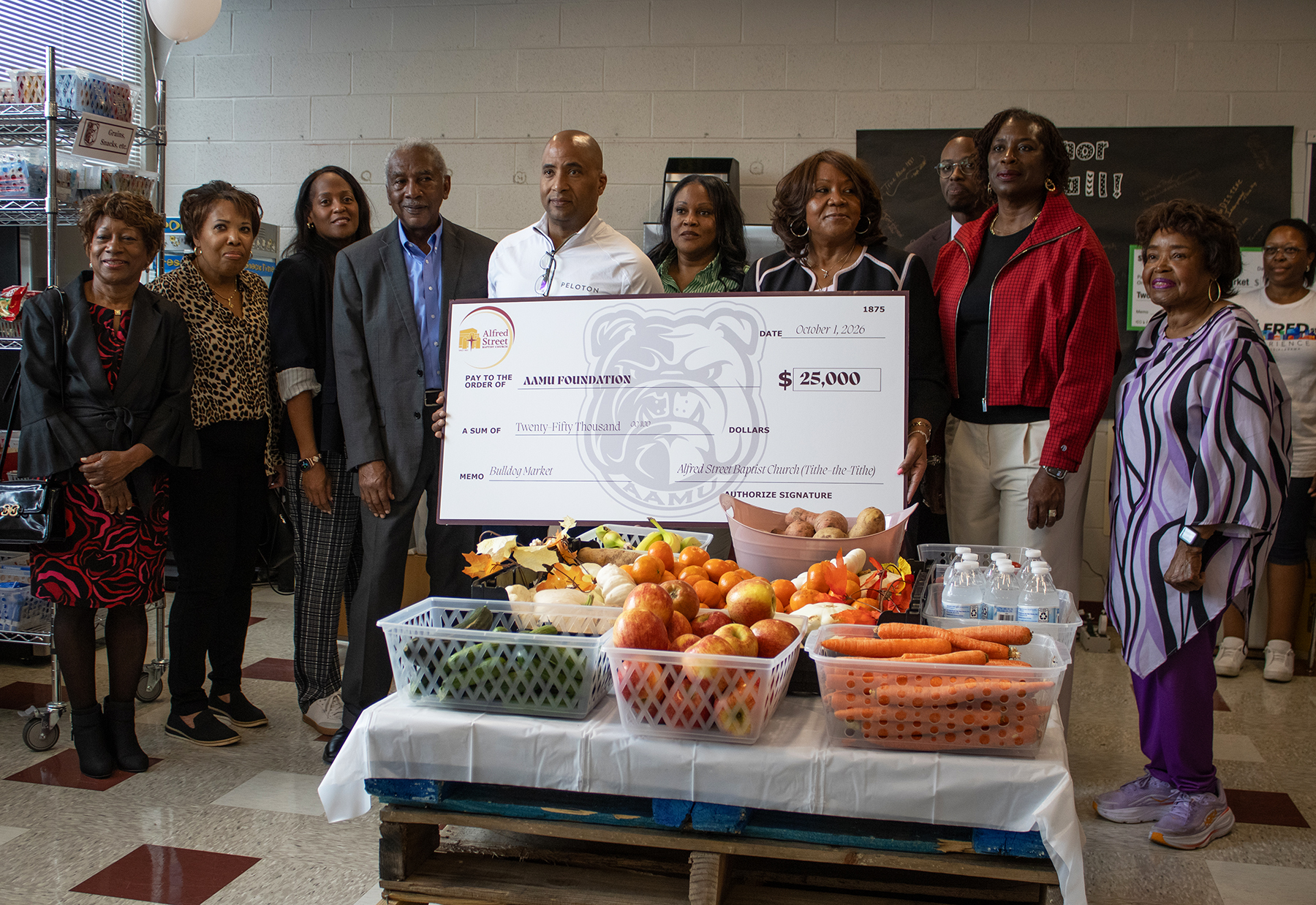 Representatives of Alfred Street Baptist Church and Alabama A&M University gather at the Bulldog Market for the presentation of a $25,000 gift to support the campus food pantry. The donation was made through the church’s Tithe-the-Tithe Initiative.