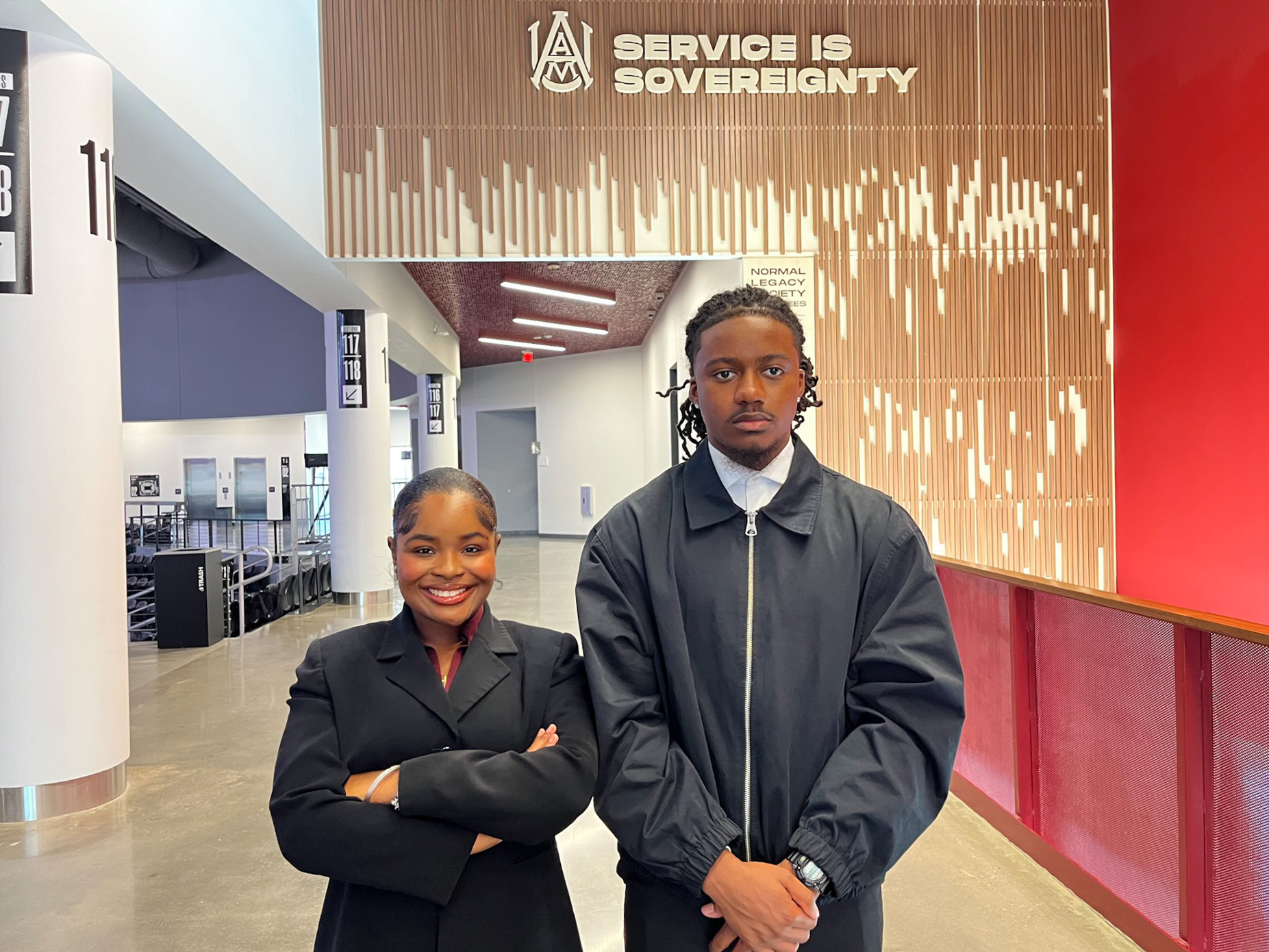 Watkins and Grant standing in the AAMU Event Center