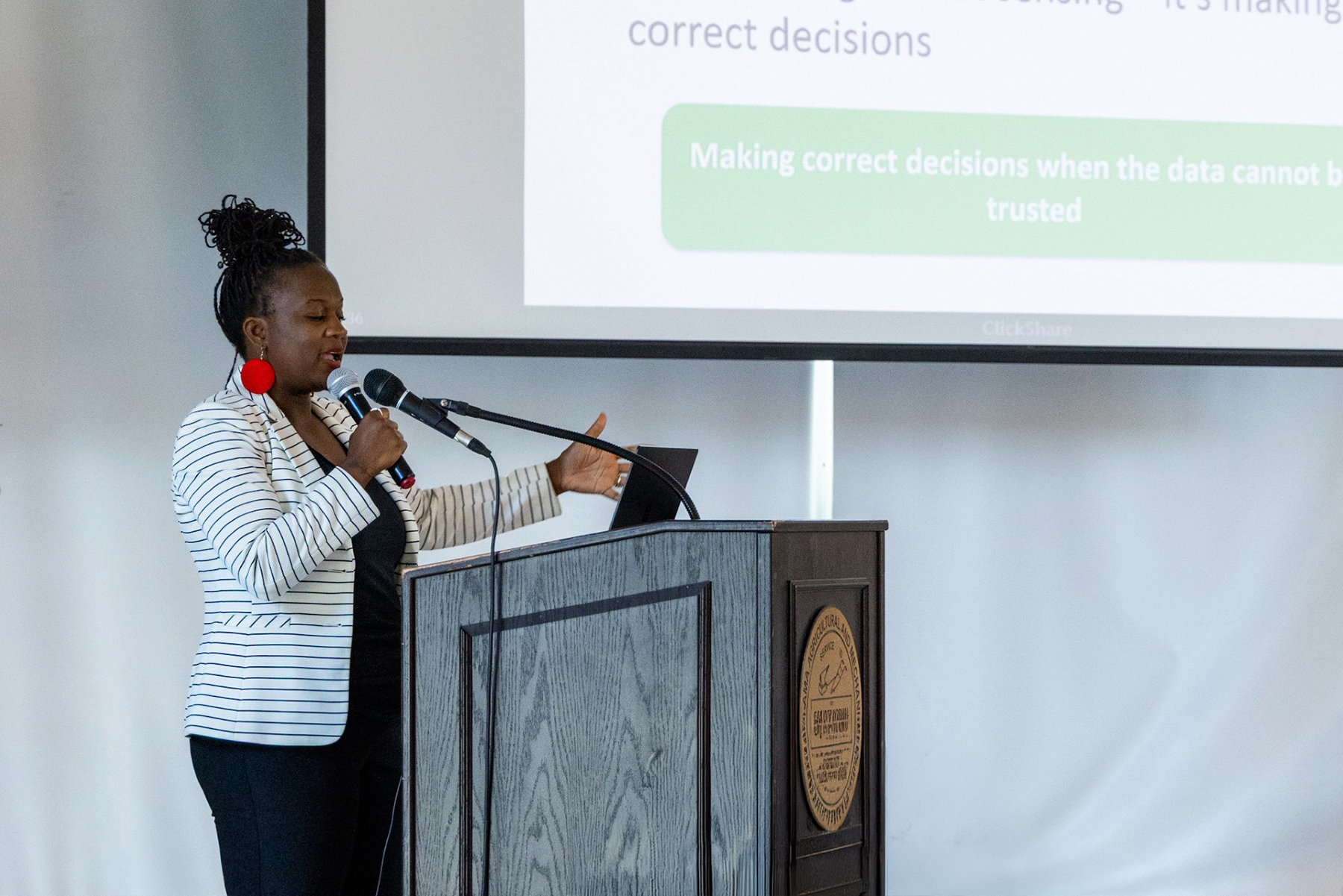 Engineering Instructor Delores Baker presents her research to U.S. Space Command Officials