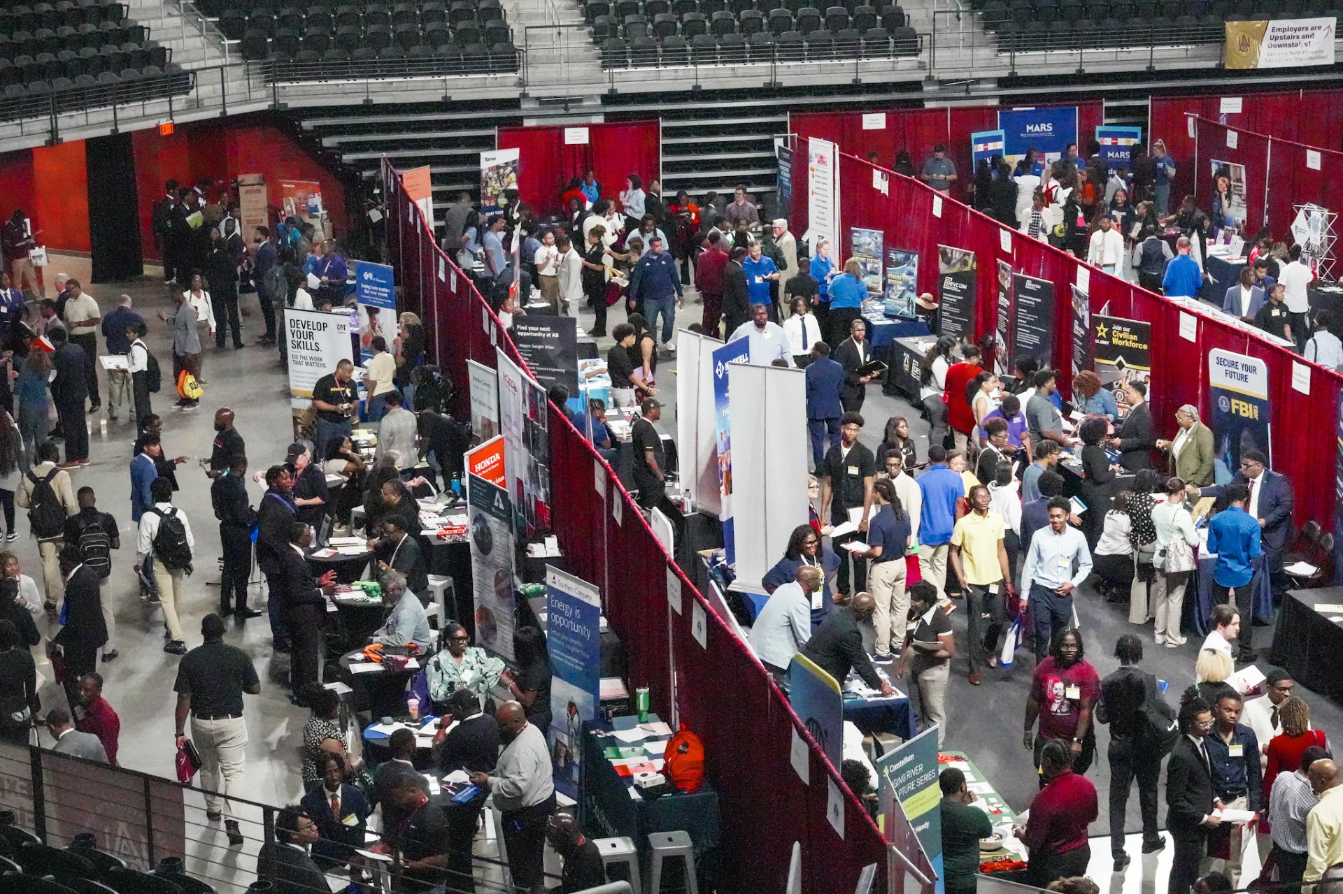 Overhead shot of students visiting employer booths at AAMU's Fall 2024 Career Fair