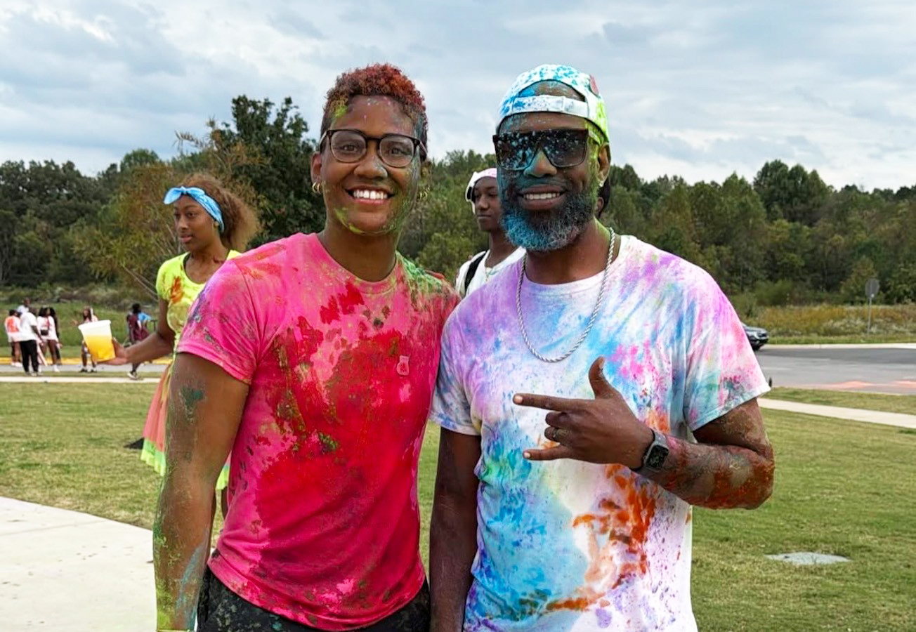 Two runners covered in paint from last year