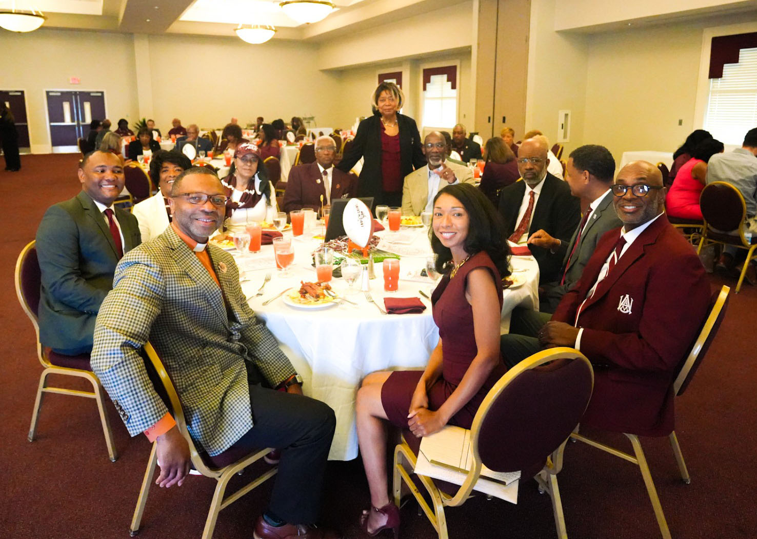 Guest Speaker Brawnski Towns Seated at Table with President Wims, AD Bryant and others