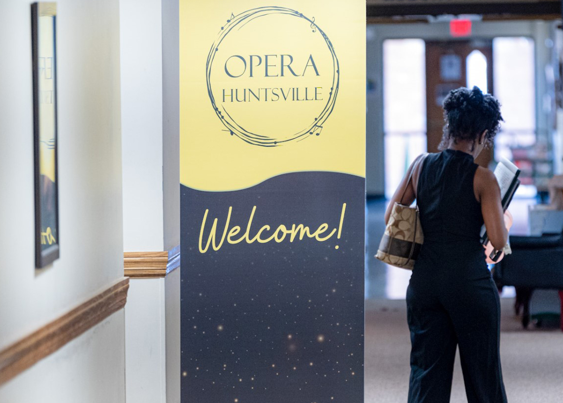 Women by Huntsville Opera Sign