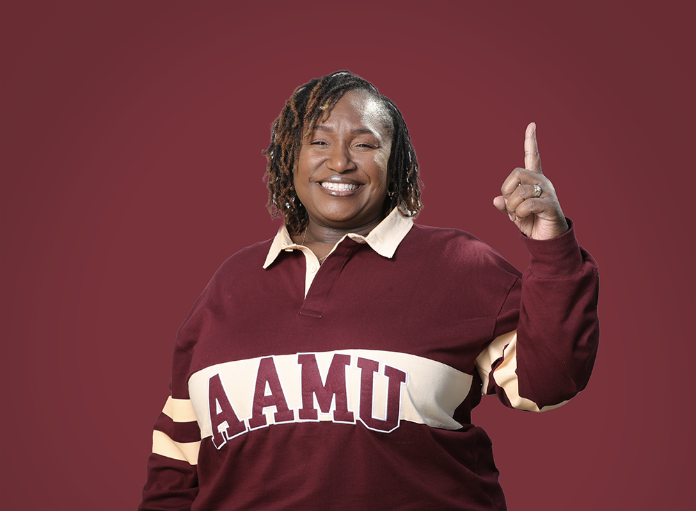 Christina Lincoln-Moore smiles wearing AAMU sweater