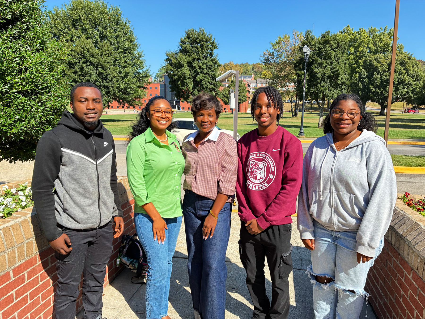 Alabama A&M University alumna Eboni Major, center, connects with students during her return to The Hill for Homecoming 2026.