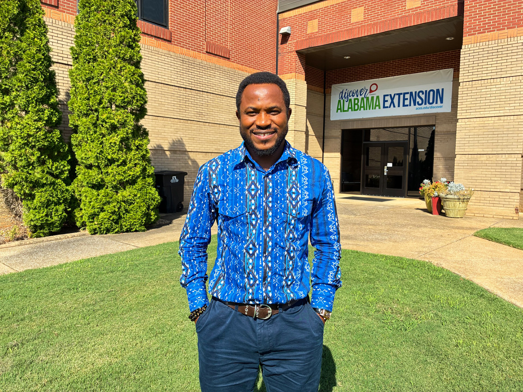 Dr. Felix Samuel stands outside the Dawson Building at Alabama A&M University.