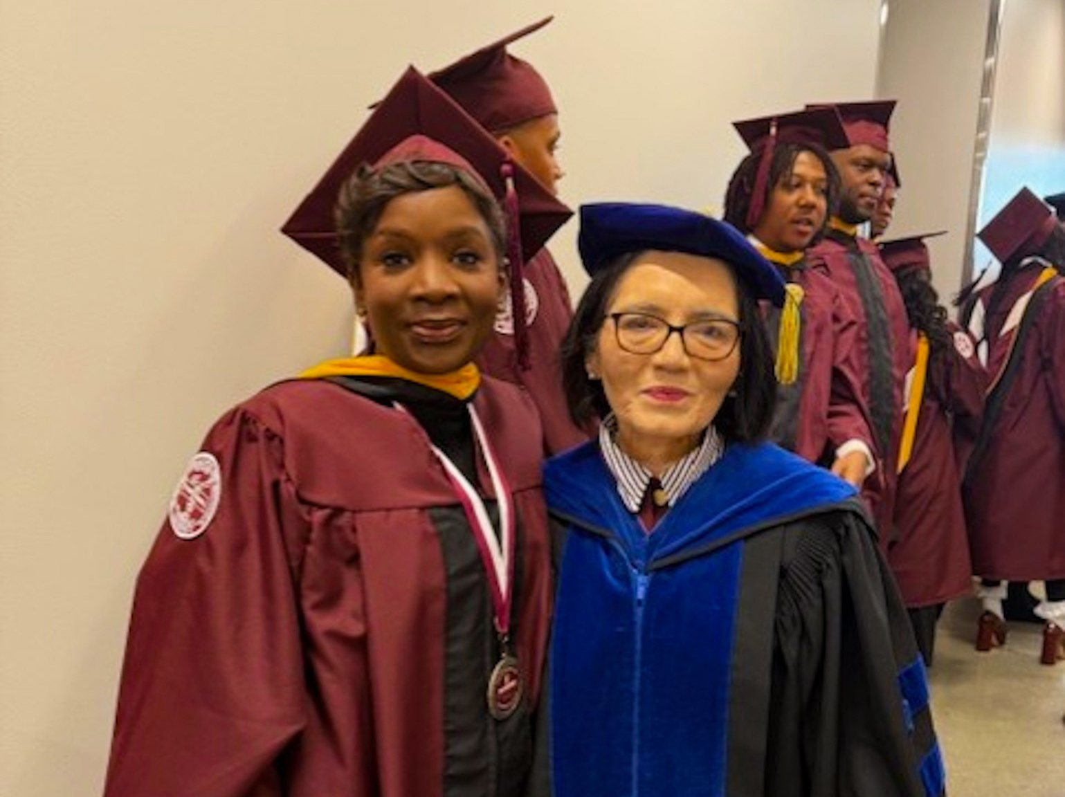 Acclaimed whiskey blender and Alabama A&M alumna Eboni Major, left, celebrates earning her Master of Science in Food Science Business with Dr. Martha Verghese, chair of the Department of Food and Animal Sciences, during Alabama A&M University’s December 2025 commencement.