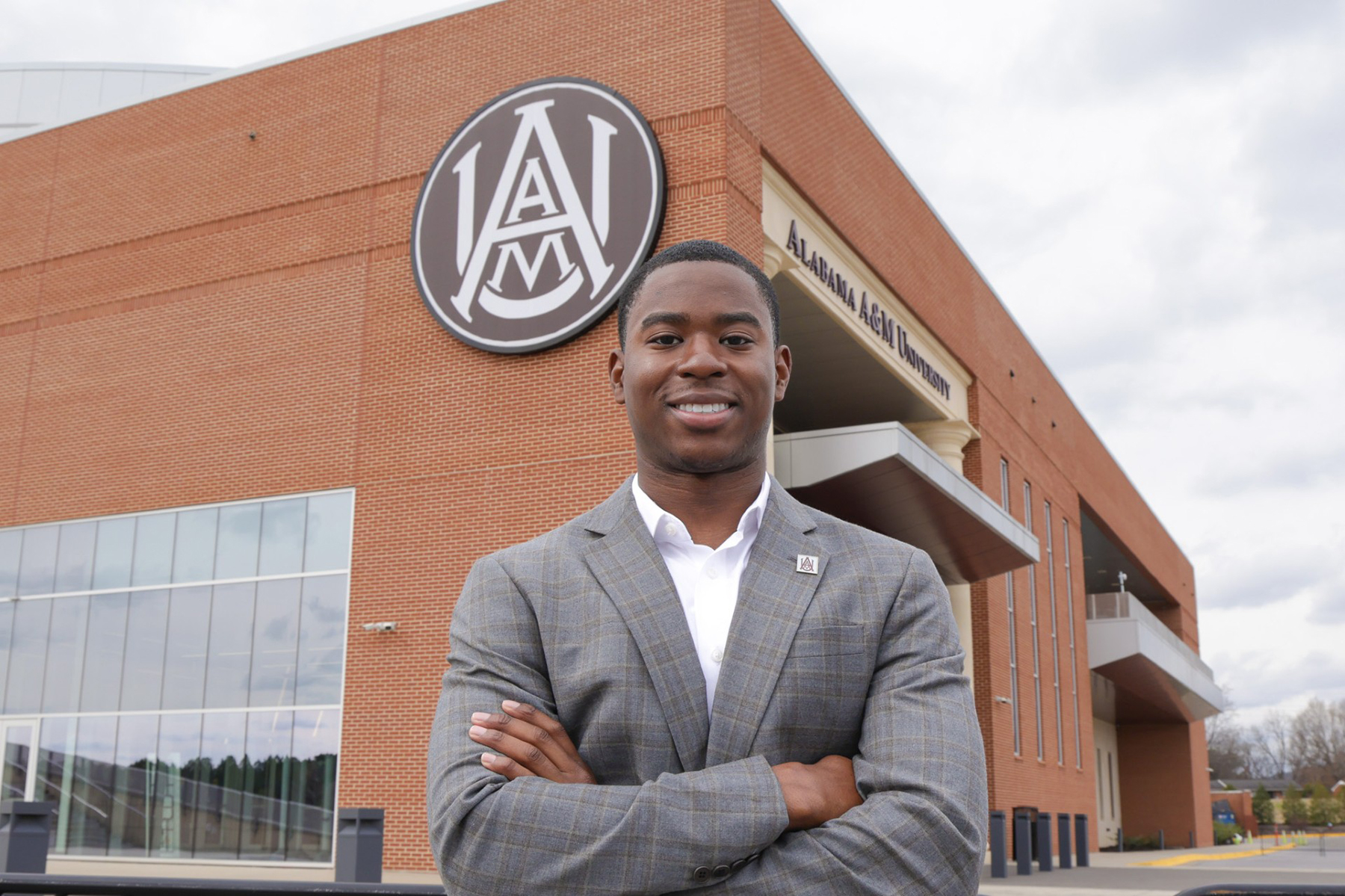 Bryson Hannah smiles outside the Event Center
