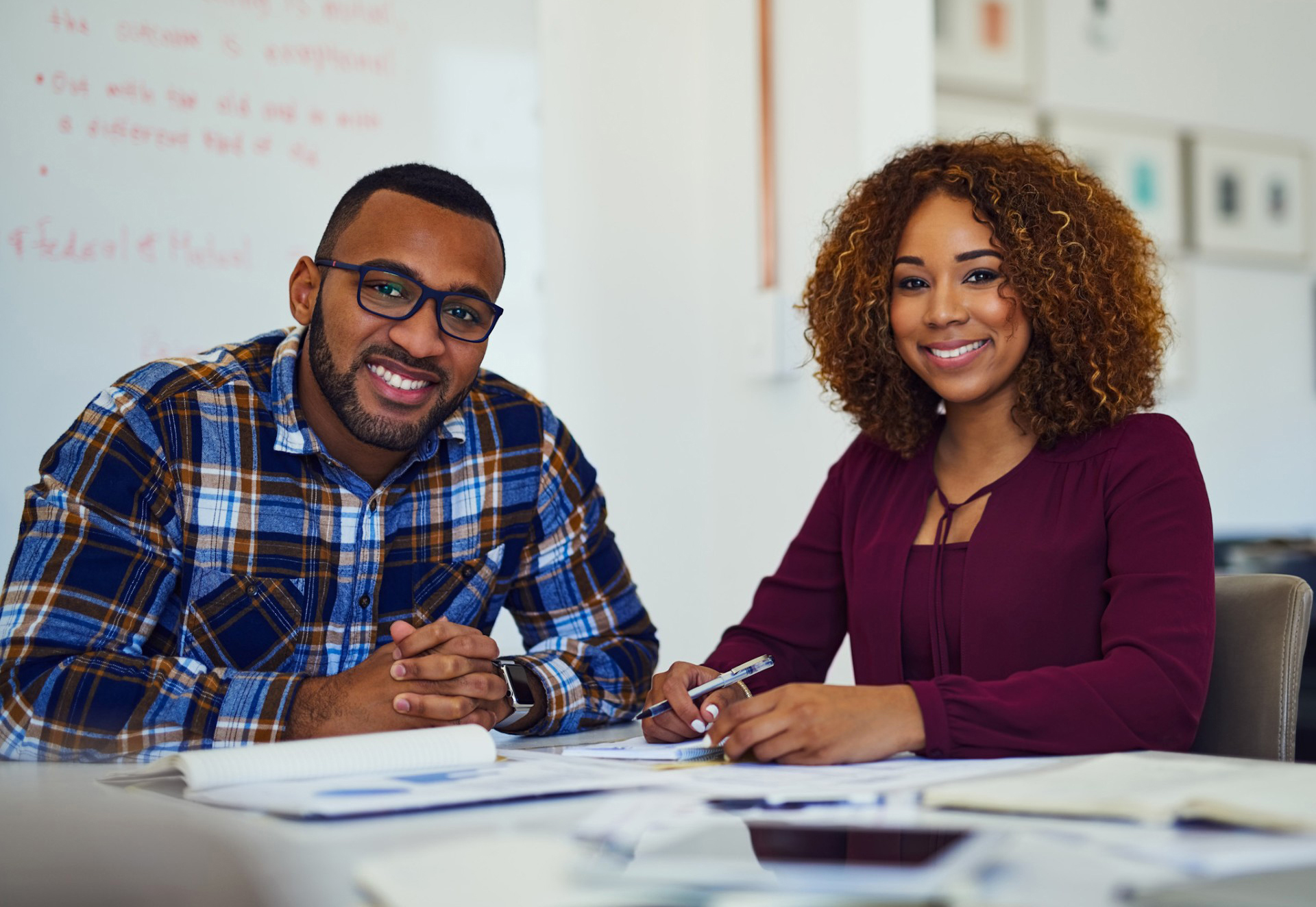 College student and advisor sitting at a desk
