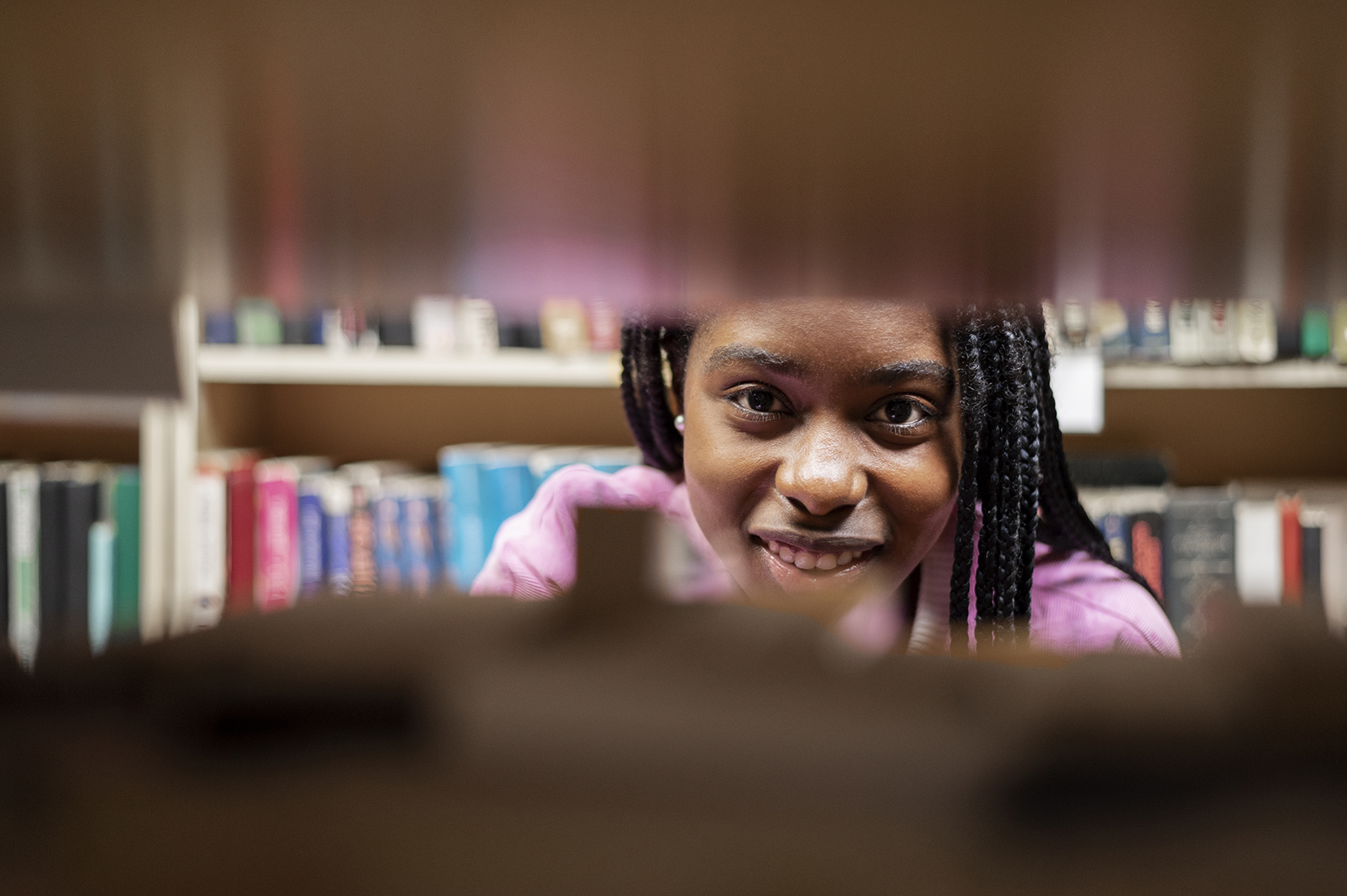 student in library