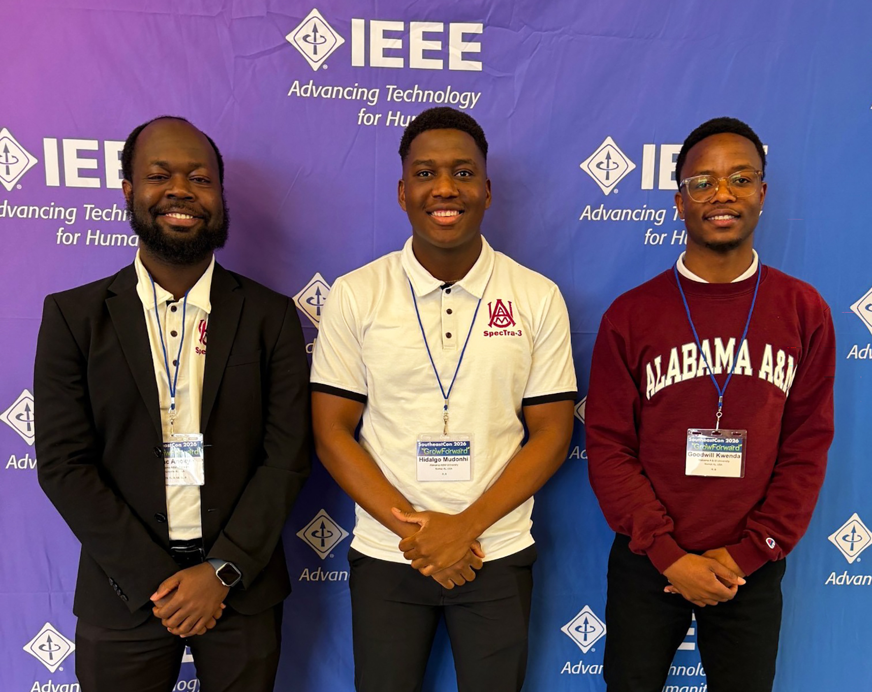  Isaac Anokye, Hidalgo Mudonhi, Goodwill-Munashe Kwenda stand in front of IEEE SoutheastCon banner