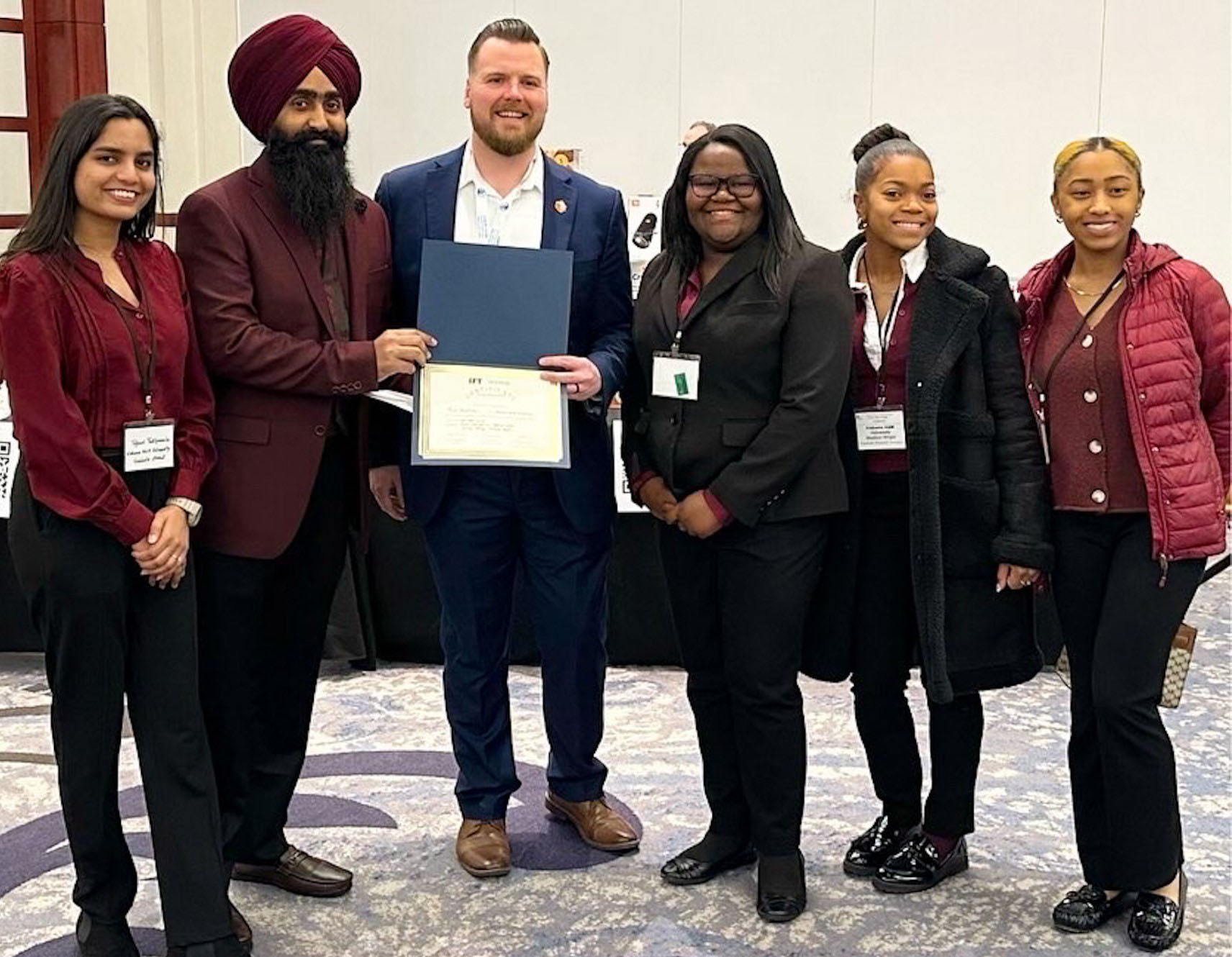 (Photo L-R) Tejasri Thatipamula, Harpreet Singh (Team Leader), Alex Ryan Thompson (President, Southeastern Section, IFT), Katelyn Boyle, Madison Wright, and Lauryn Strong