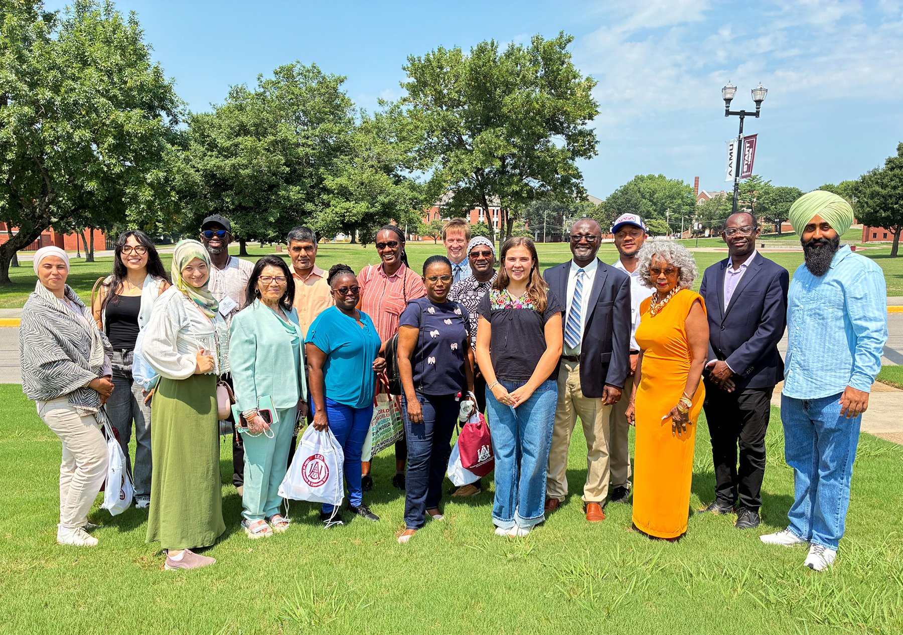 AAMU faculty and staff join African agricultural leaders for a group photo outside AAMU's Carver Complex.