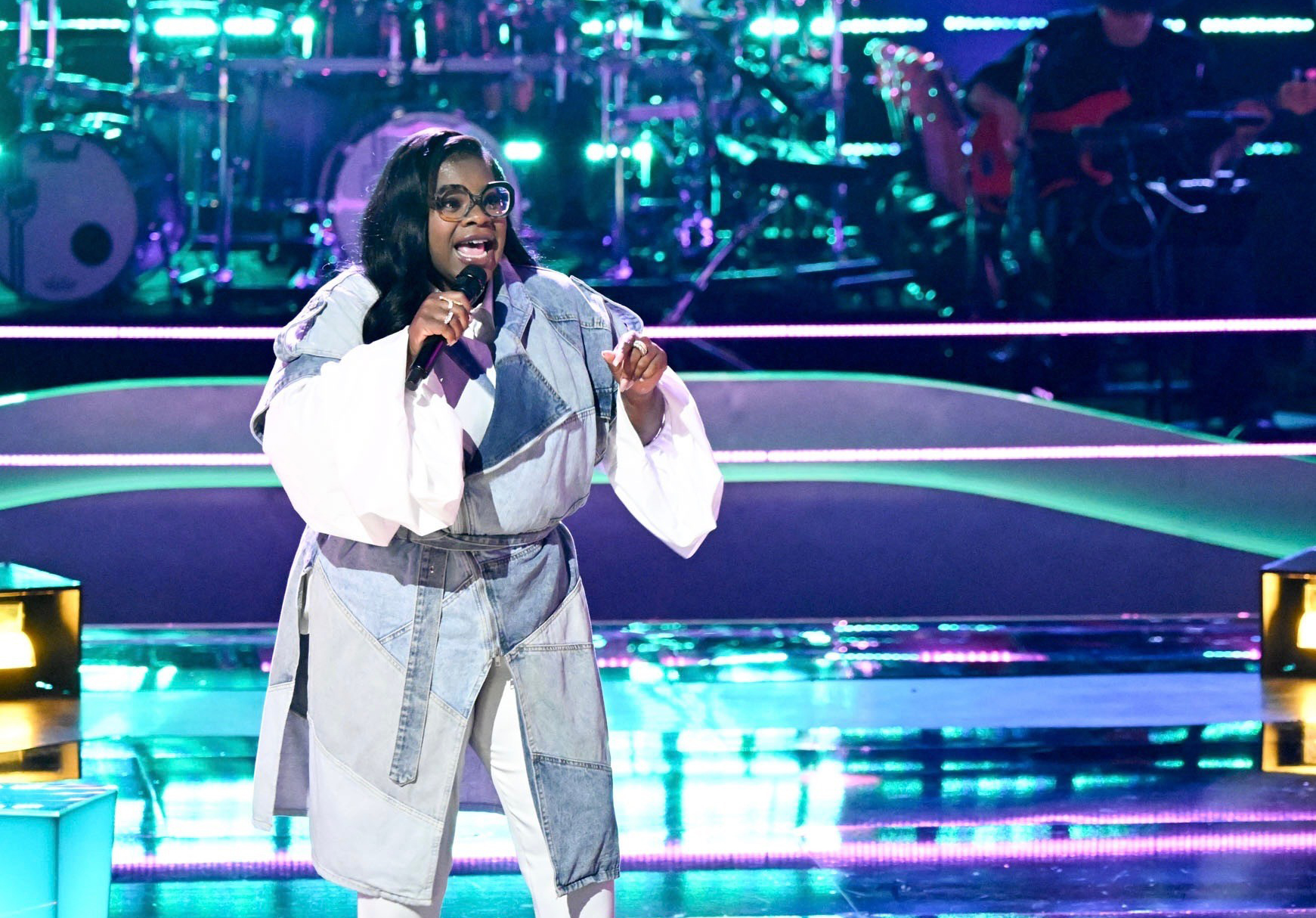 Jazz McKenzie sings on stage during "The Battles" round on NBC's 'The Voice'