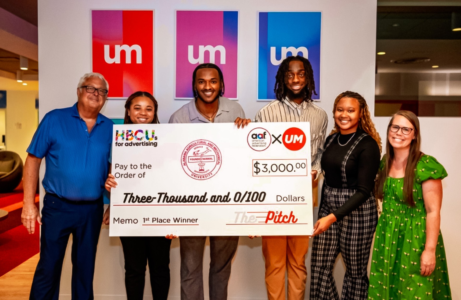 Marketing Students in coaches with Winning Check for $3,000