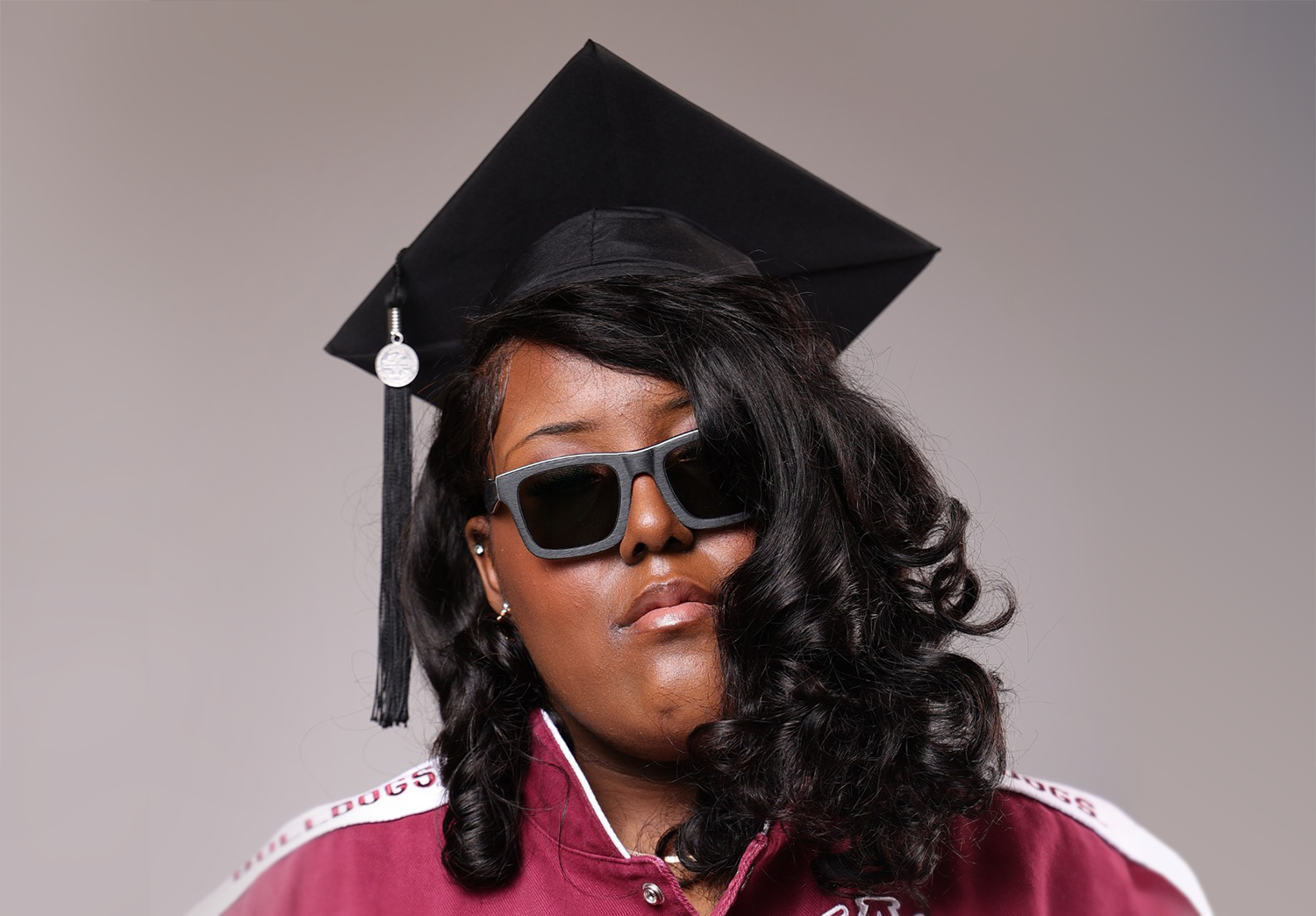 Mikaylah Pratt wearing sunglasses and an AAMU sweater