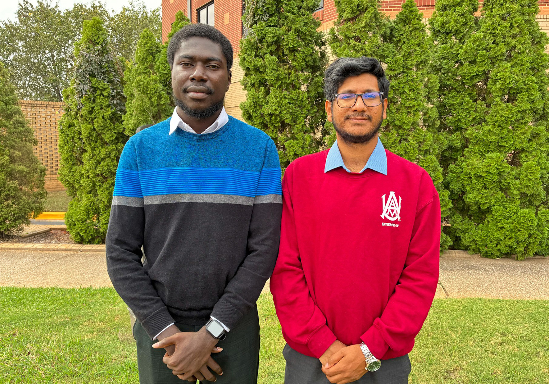 Nathaniel Peprah (left) and Syed Riad Morshed, AAMU graduate students in urban and regional planning, stand outside Dawson Building. The two are among three nationwide recipients of the 2026 APA Foundation Environmental Planning Scholarship.