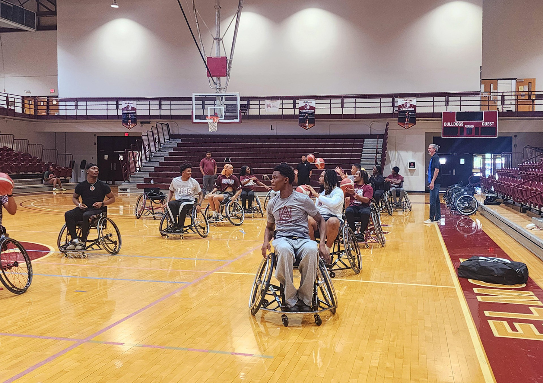 Dr. David Kyle on the sideline working with AAMU students at Elmore Gym