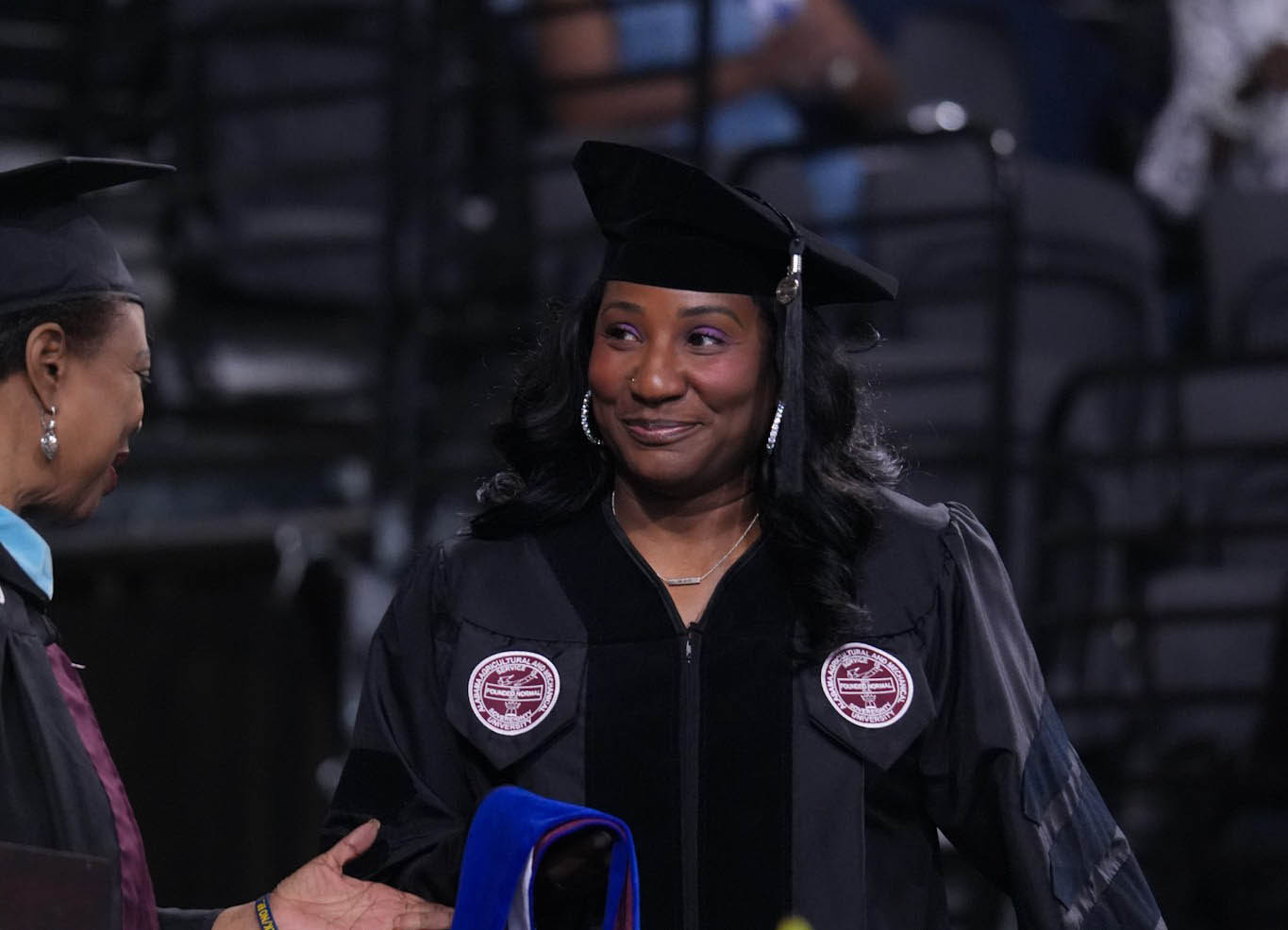 Dr. Angela Davis walks on stage at AAMU's Spring '25 Commencement