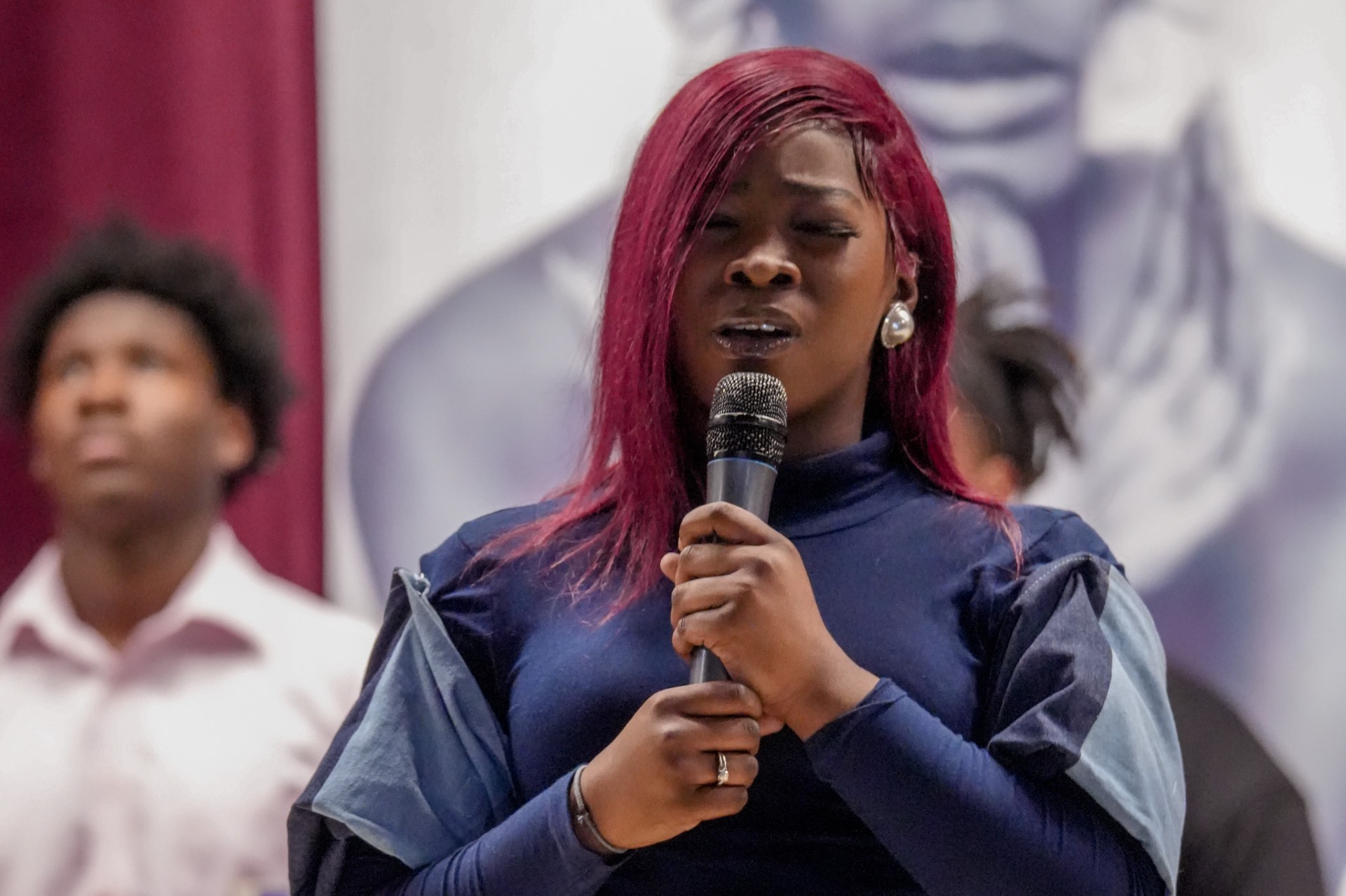 AAMU student at the microphone during a recent Poetry & Fashion Show at AAMU