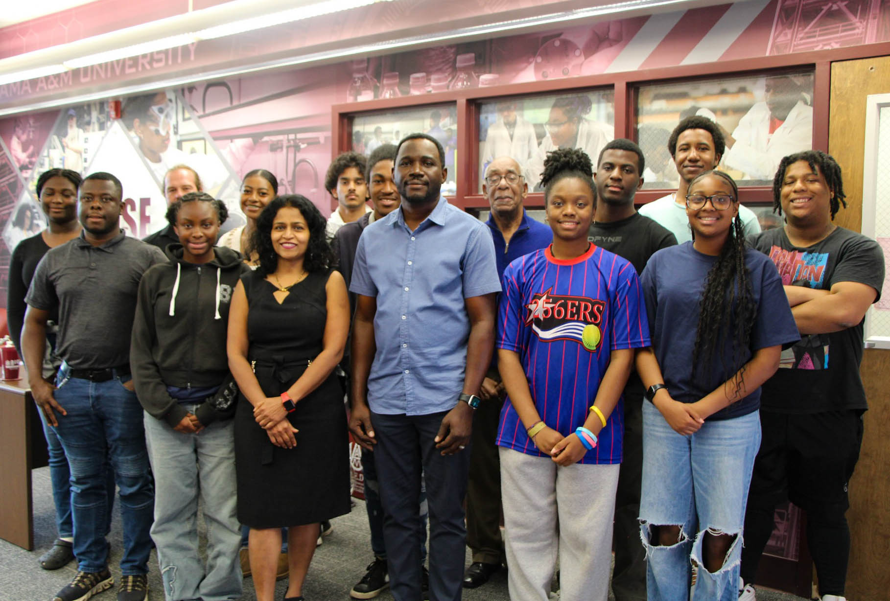 Drs. Babalola, Guggilla and Lassiter stand with high school students and two members of NACEE inside AAMU's Howard J. Foster Irradiation Complex