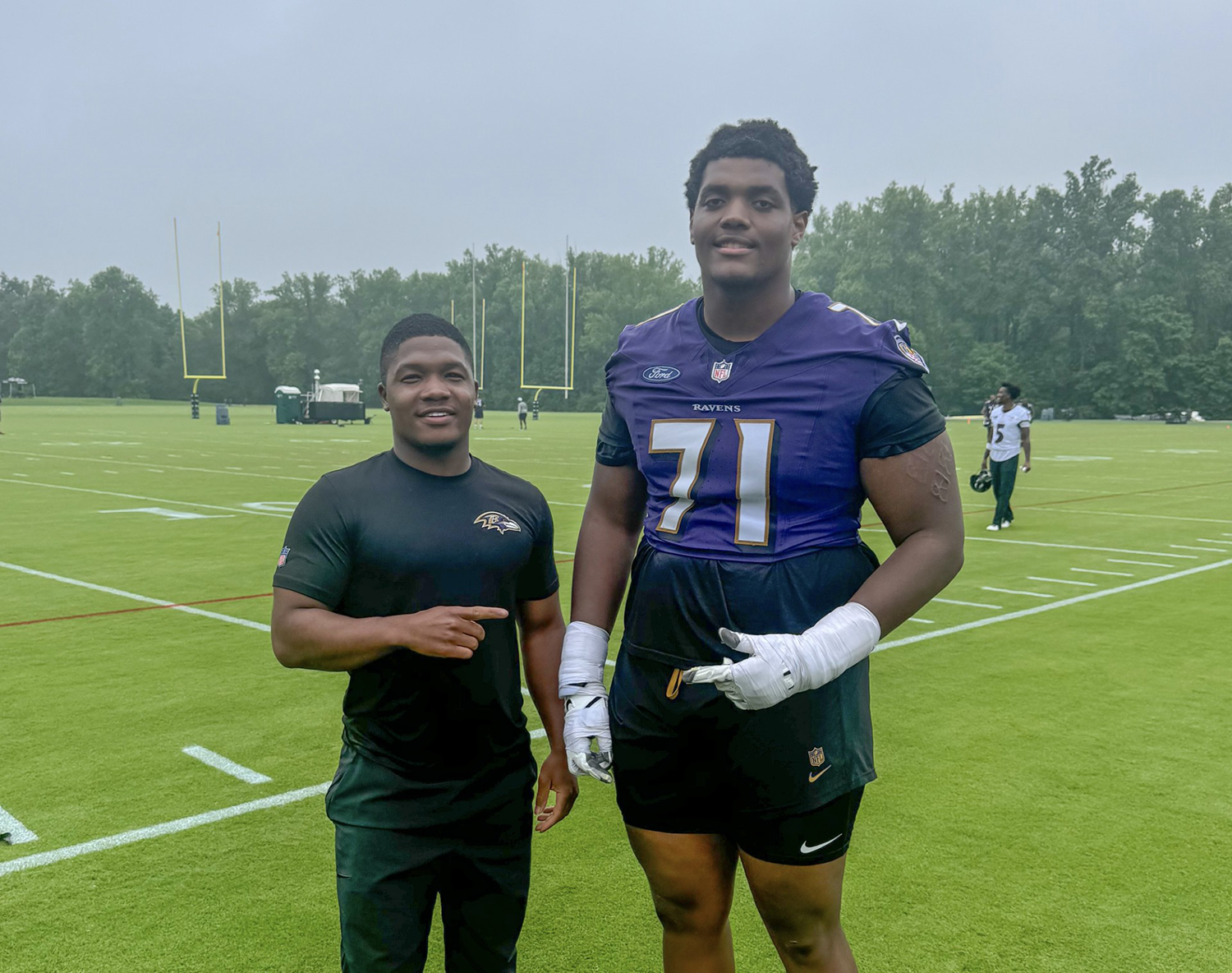 AAMU alumni Da'Vonta Ealy and Carson Vinson point at each other on the Ravens practice field