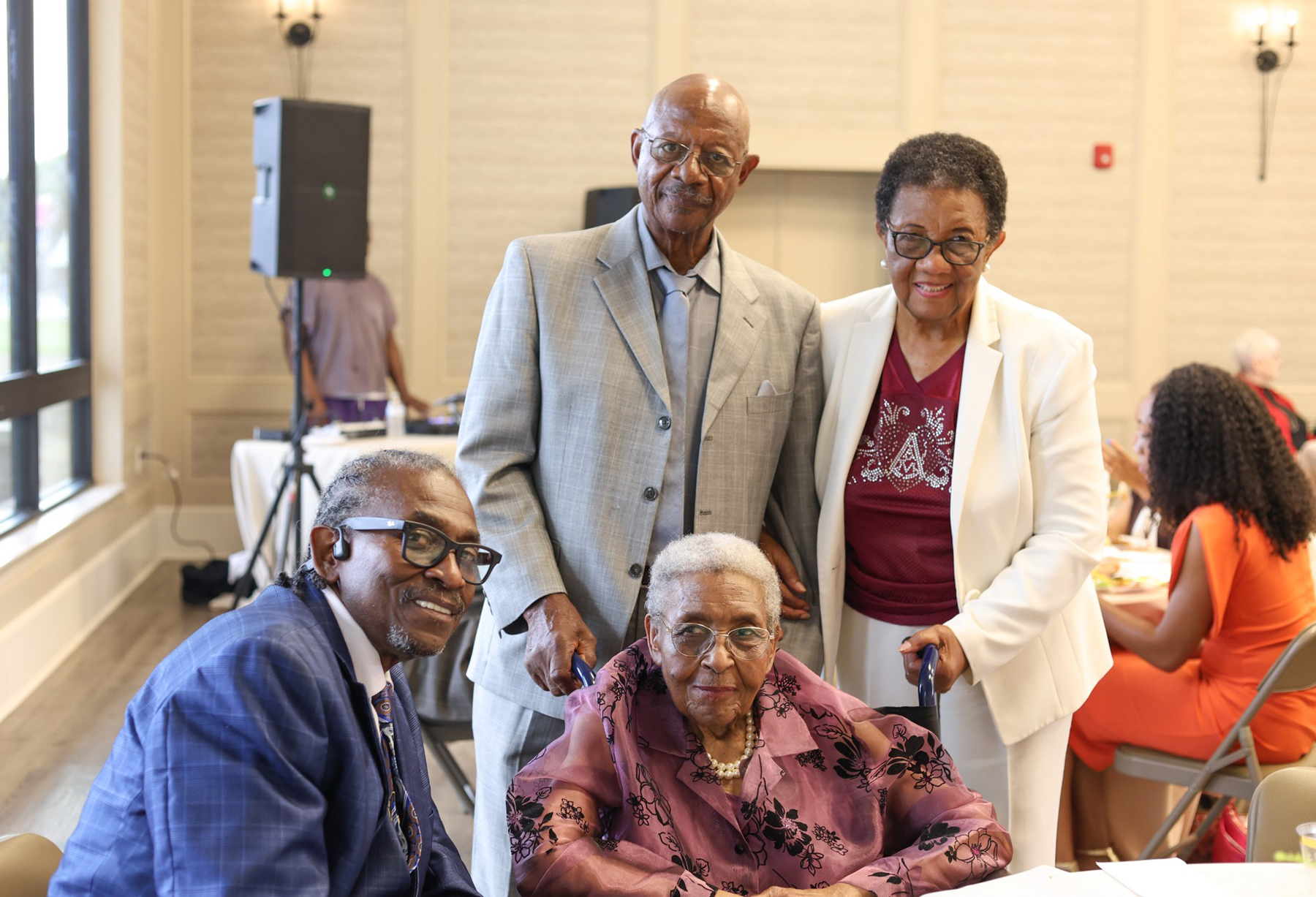 From left, Adolph Scissum, son of Jeanette Scissum; Jeanette Scissum, seated; her husband, Andrew Mickens; and Dr. Barbara Jean Henderson Anthony gather during the City of Guntersville’s recognition of Scissum and Anthony.