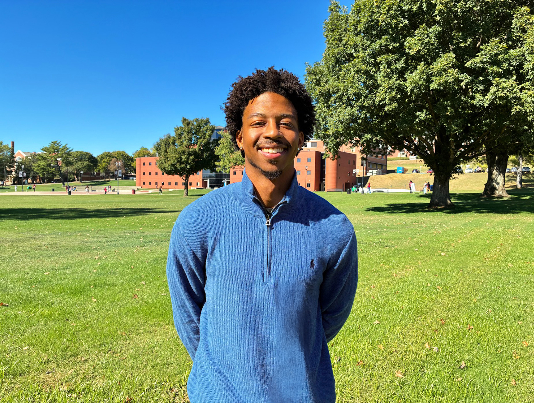 Harvard University graduate and former football player Gavin Shipman, now pursuing a Ph.D. in food science at AAMU, stands outside the Carver Complex on the Quad.