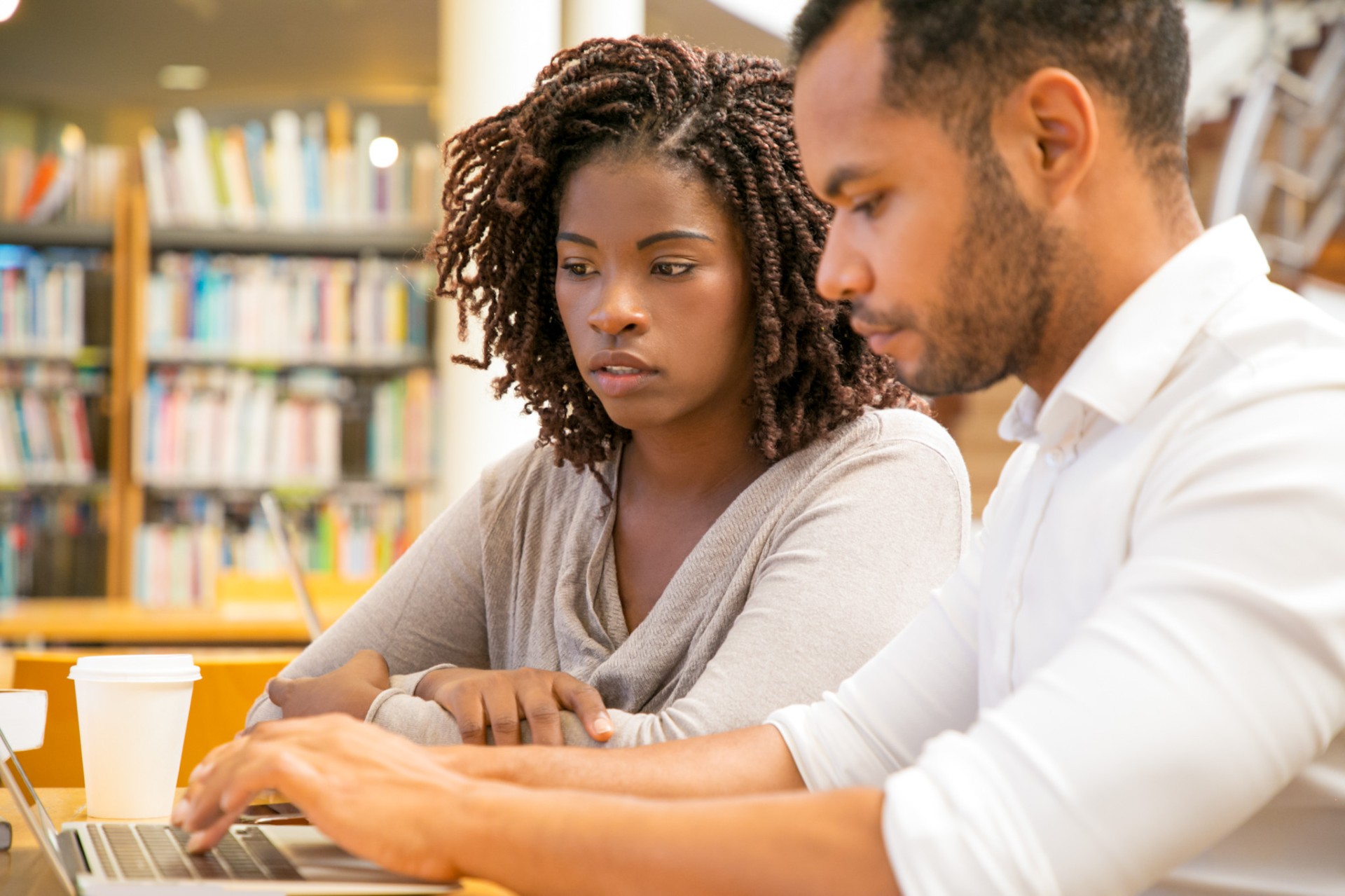 Student and teacher overlooking paperwork