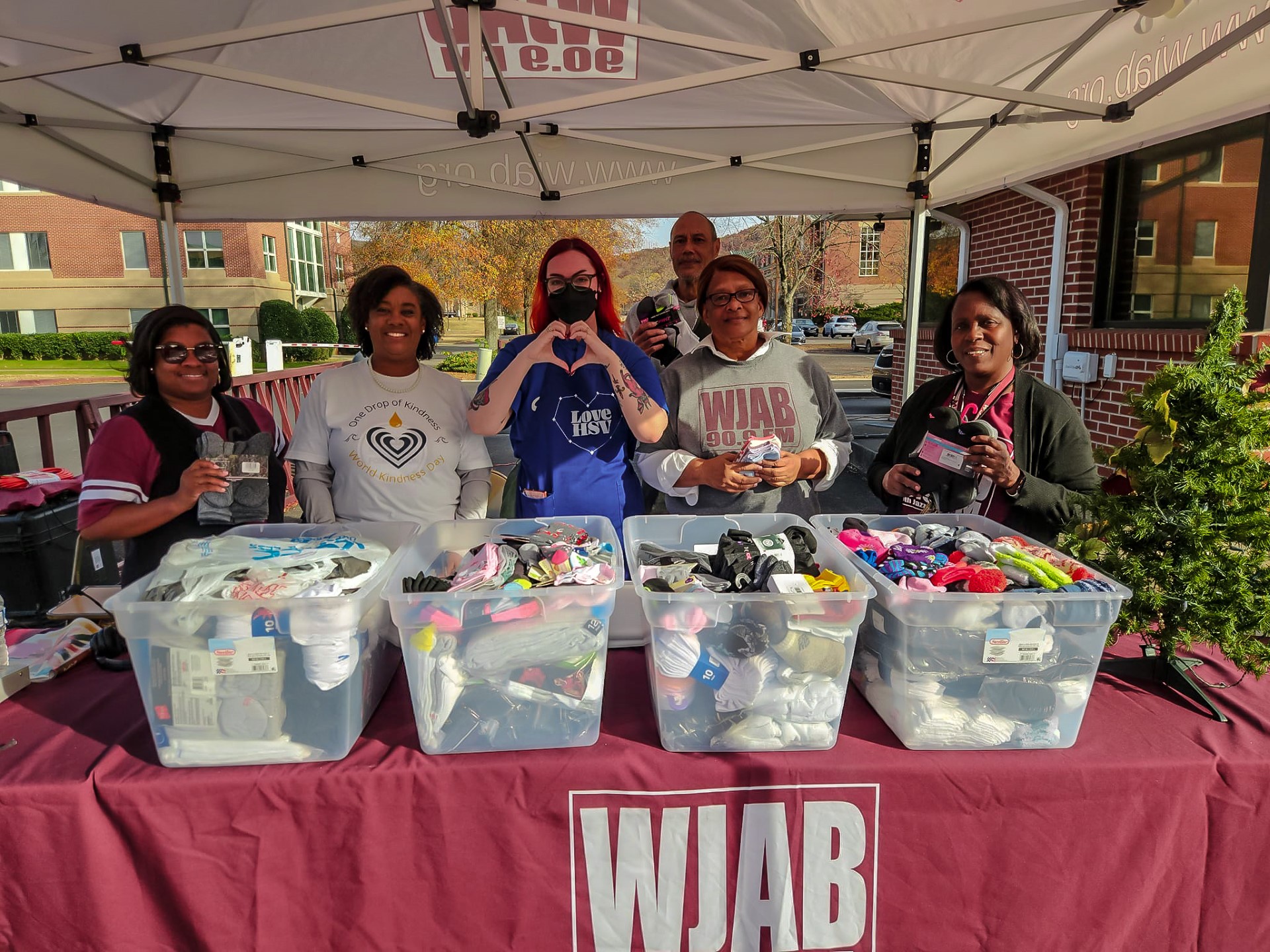 WJAB radio and TV staff and Love Huntsville staff collecting socks