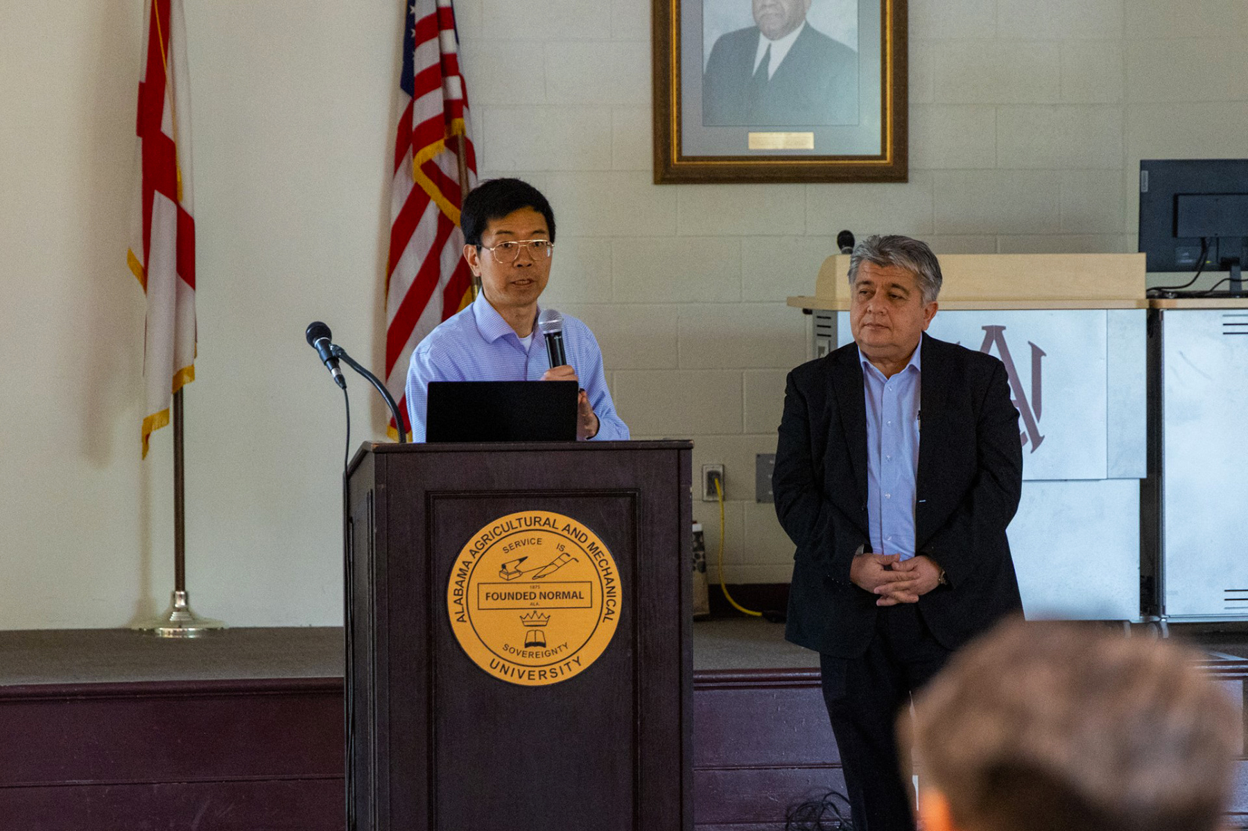 Dr. Zhigang Xiao and Dr. Satilmis Budak address representatives from U.S. Space Command.