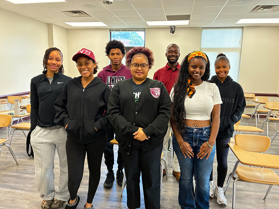 Dr. Sydney Odoi, back in red, and Jordyn Powers, front in white, are pictured with students from Odoi’s Elementary Spanish I course at Alabama A&M University.