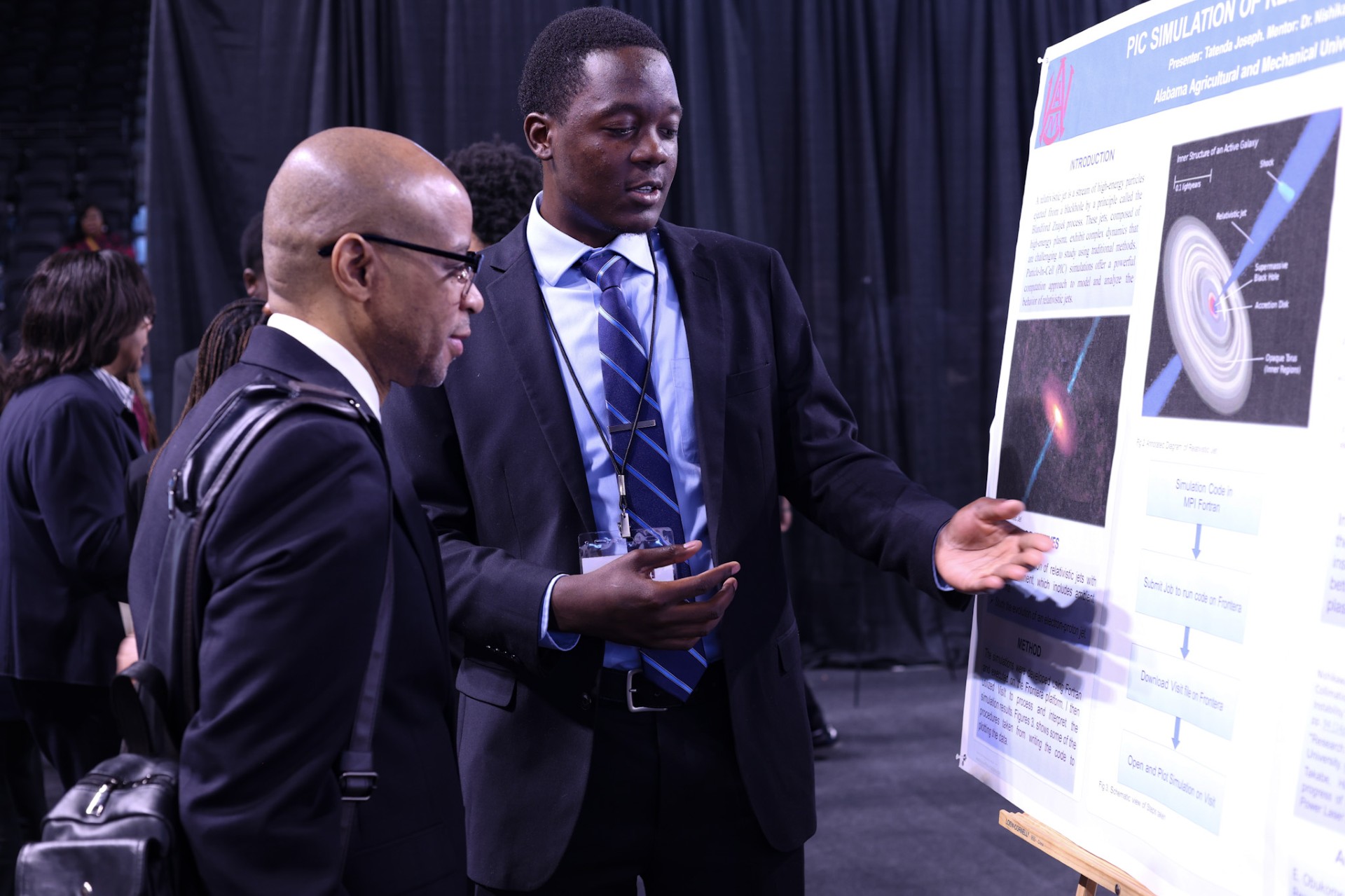AAMU Student explains his research to an AAMU administrator in his poster during STEM Day 2204