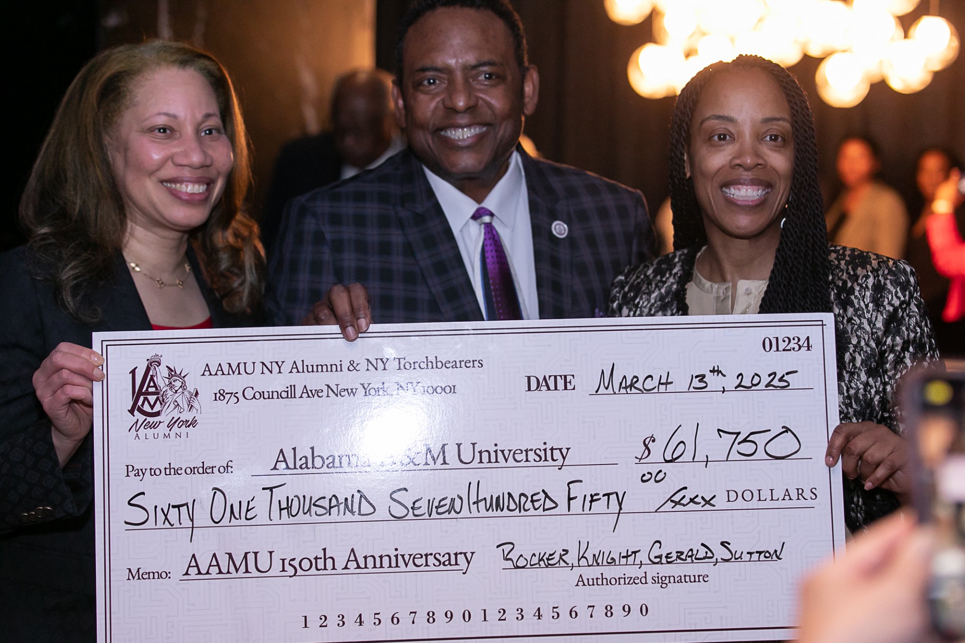 Rocker, Knight and Gerald Sutton hold $61,750 Torchbearer check