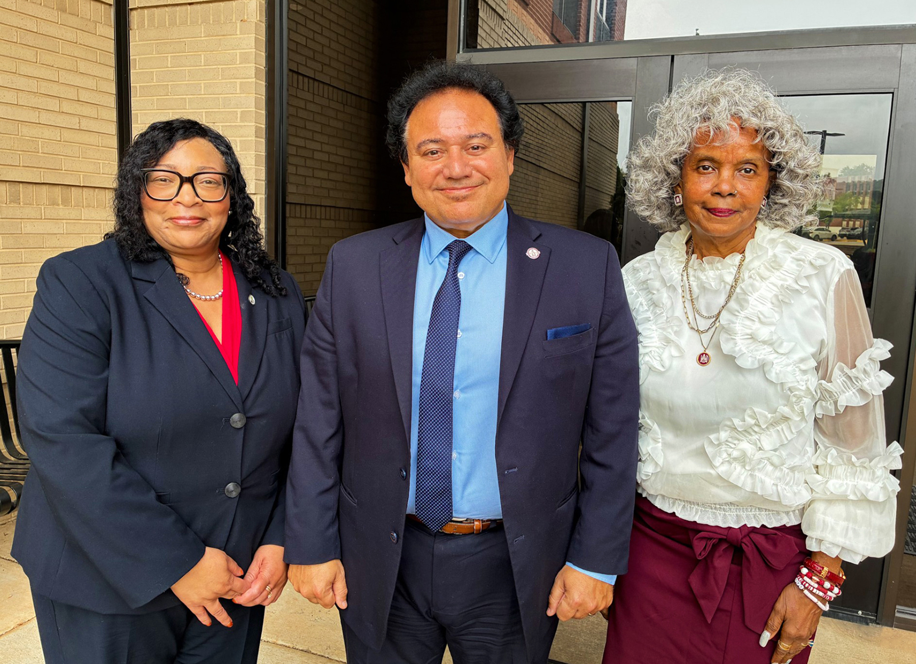 Vanessa L. Ford, AAMU USPTO Community Engagement Office director; Dr. Majed El-Dweik, vice president for Research and Economic Development; and Deborah Hunter, coordinator of Research and Economic Development, stand outside the Dawson Building on the Alabama A&M University campus.