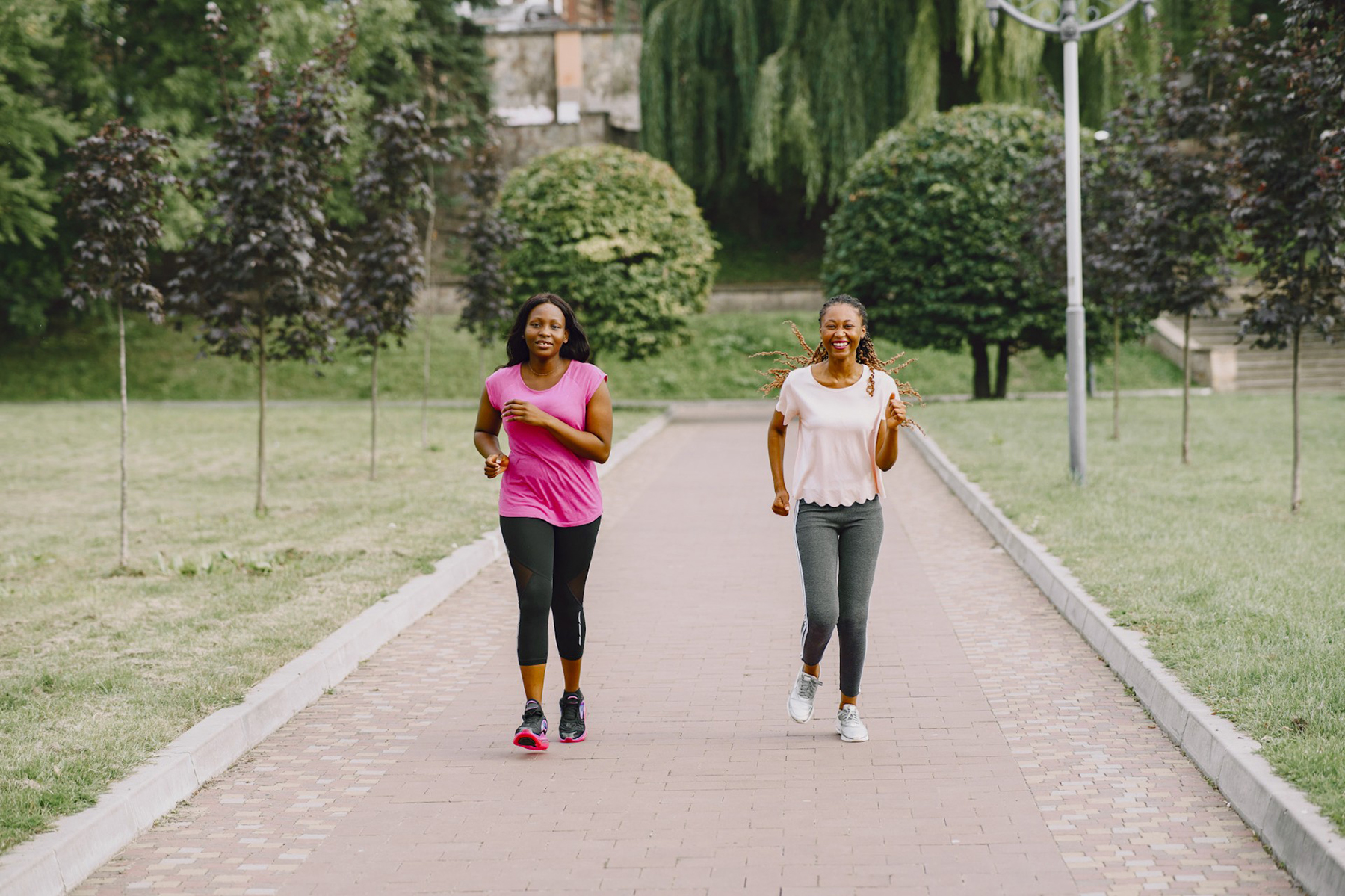 Two women walking briskly side-by-side