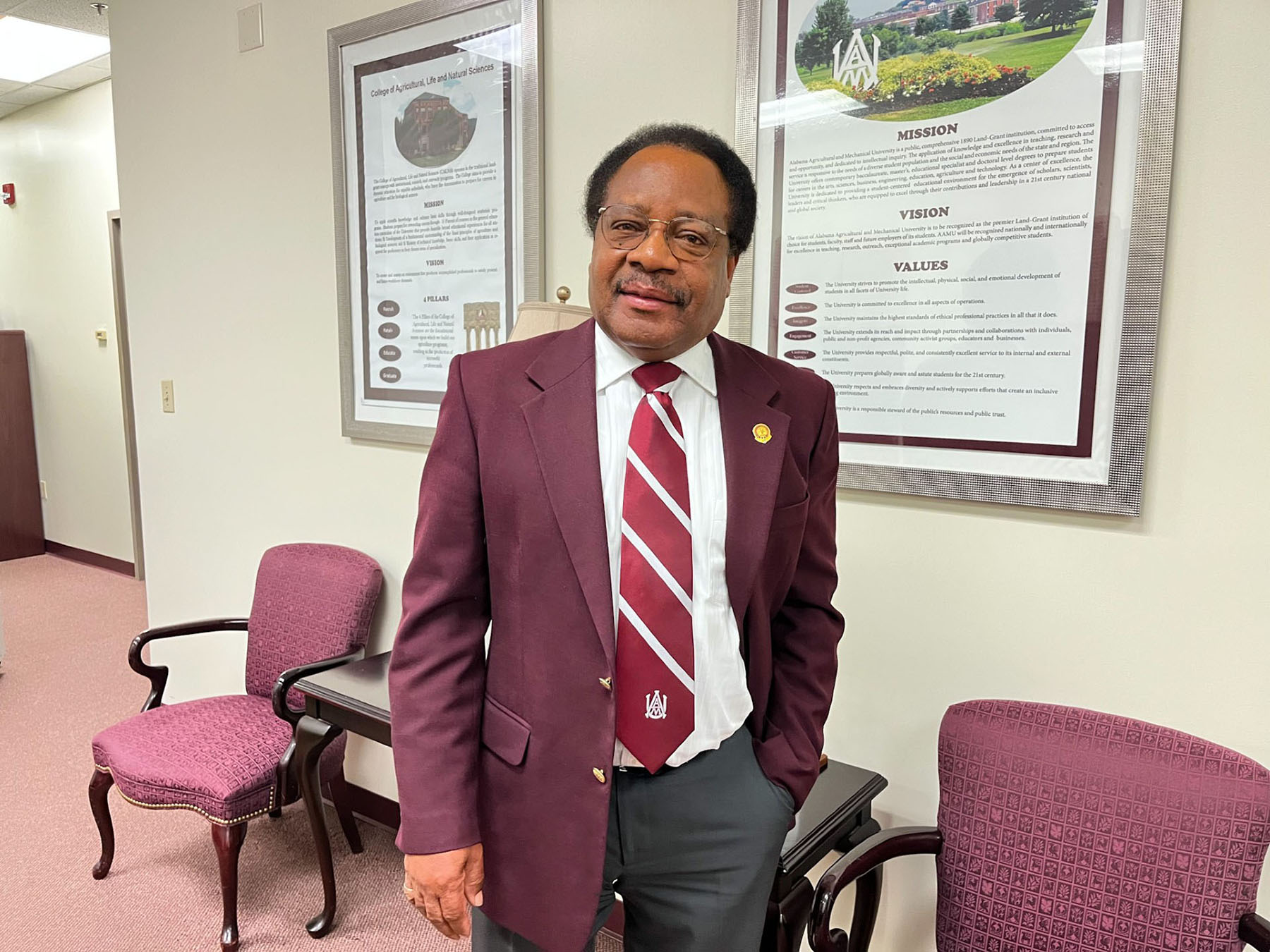 Dr. Lloyd Walker stands outside his office in AAMU's Dawson Building