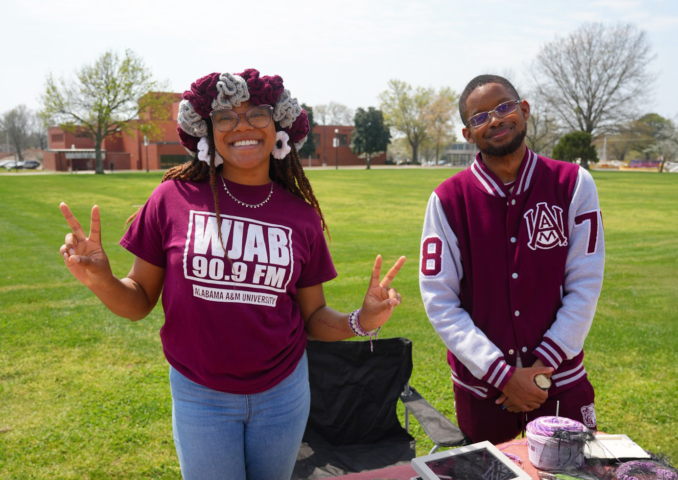 Two AAMU students on the Quad, one on the left wearing a WJAB t-shirt