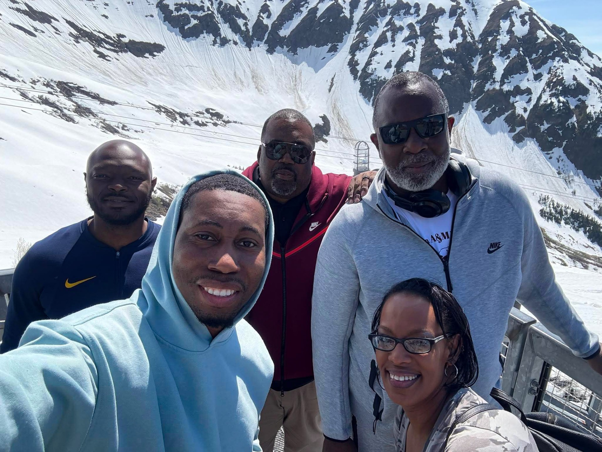 Curtis “Dolla Watson” McCullough, Dr. Kedrick Taylor, Dr. William Earvin, Carlton Wright, Erica Davidson pose in front of snow capped mountain