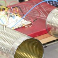 A student project consisting of two tin cans and many wires